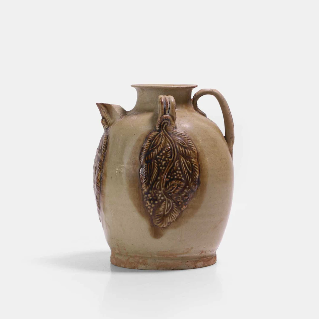 A Chinese Changsha amber and straw-glazed stoneware ewer Tang dynasty