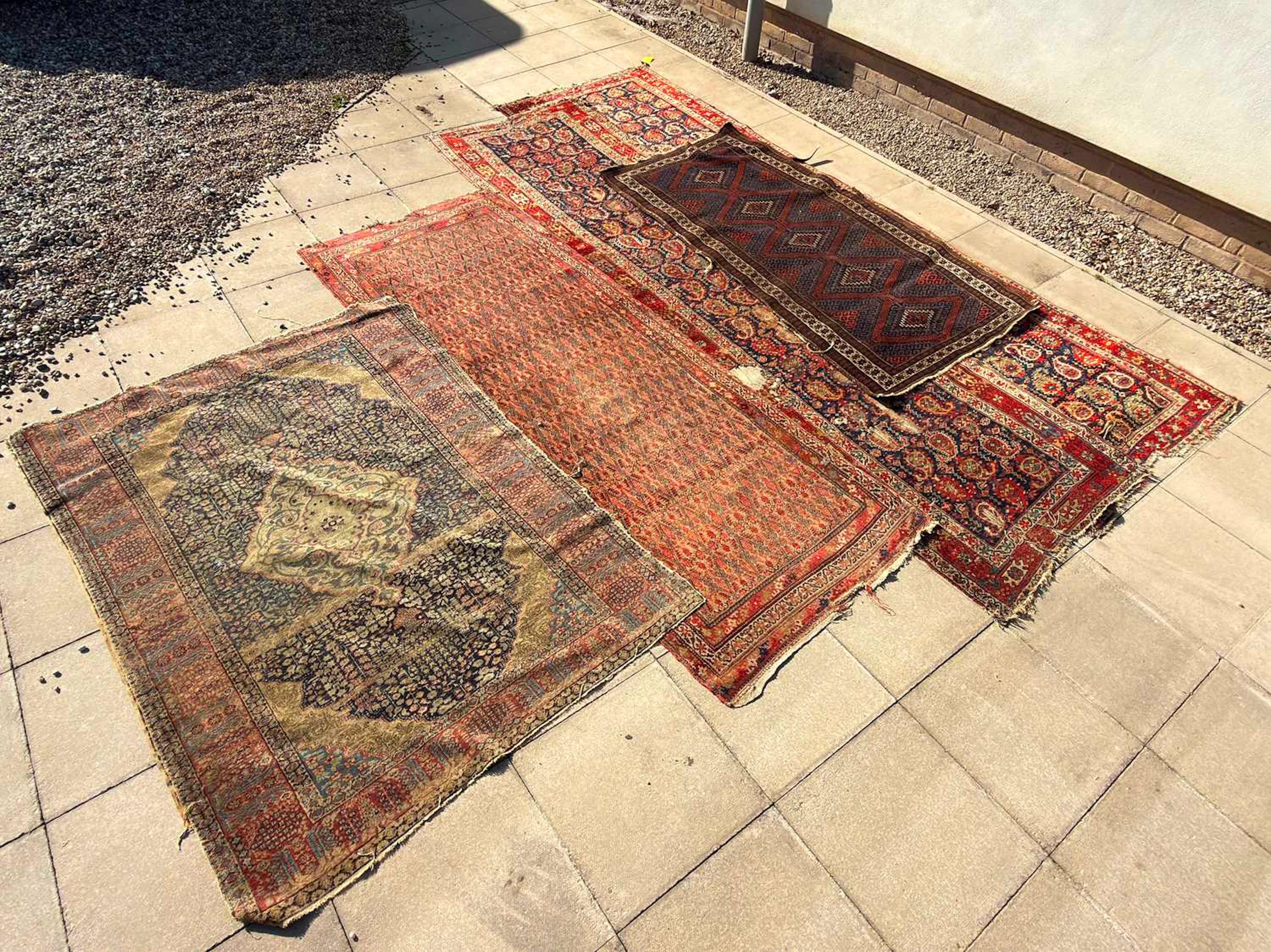 A group of five Persian rugs 19th to 20th century