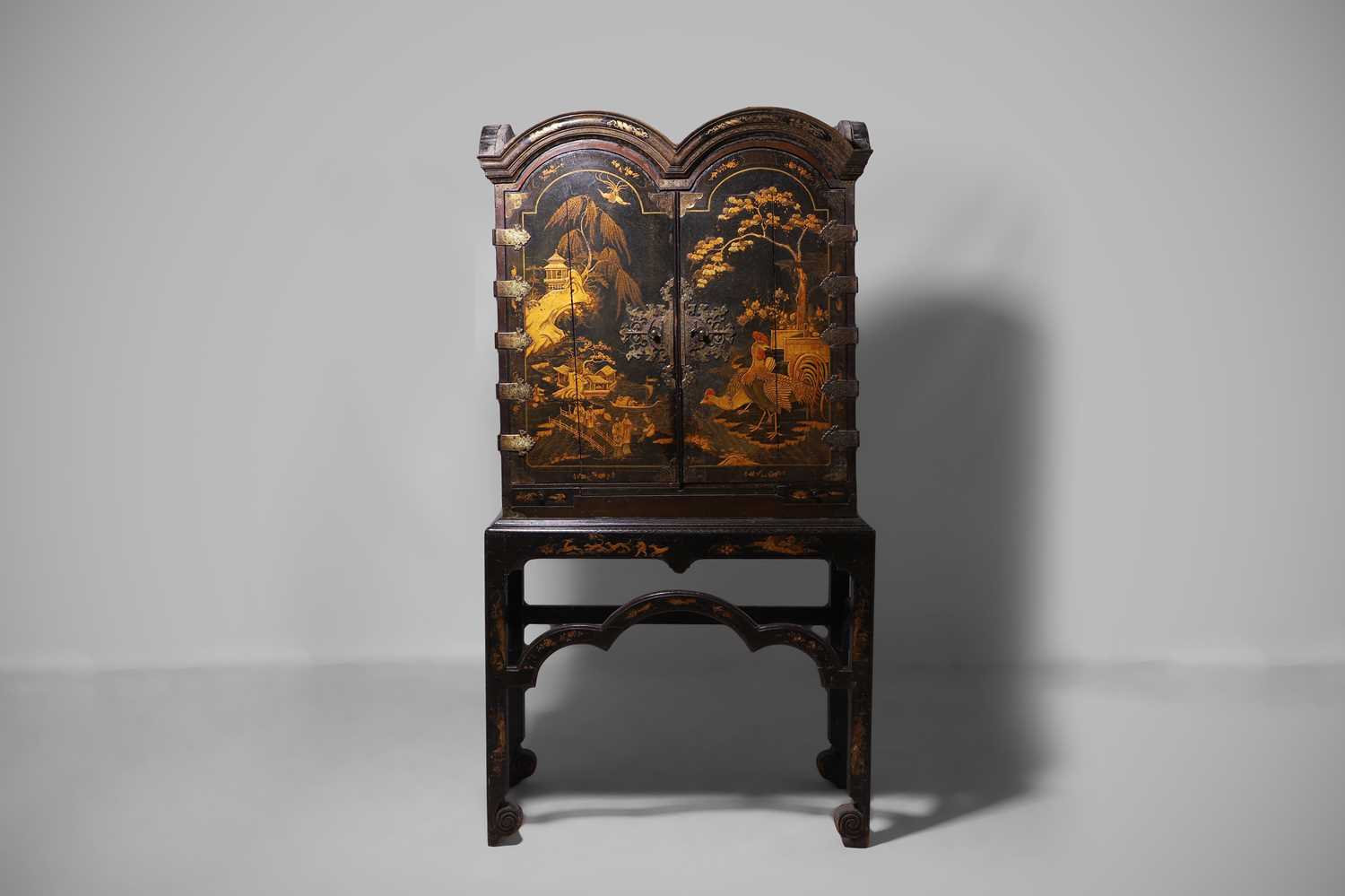 A Queen Anne black-and-gilt japanned cabinet-on-stand early 18th century