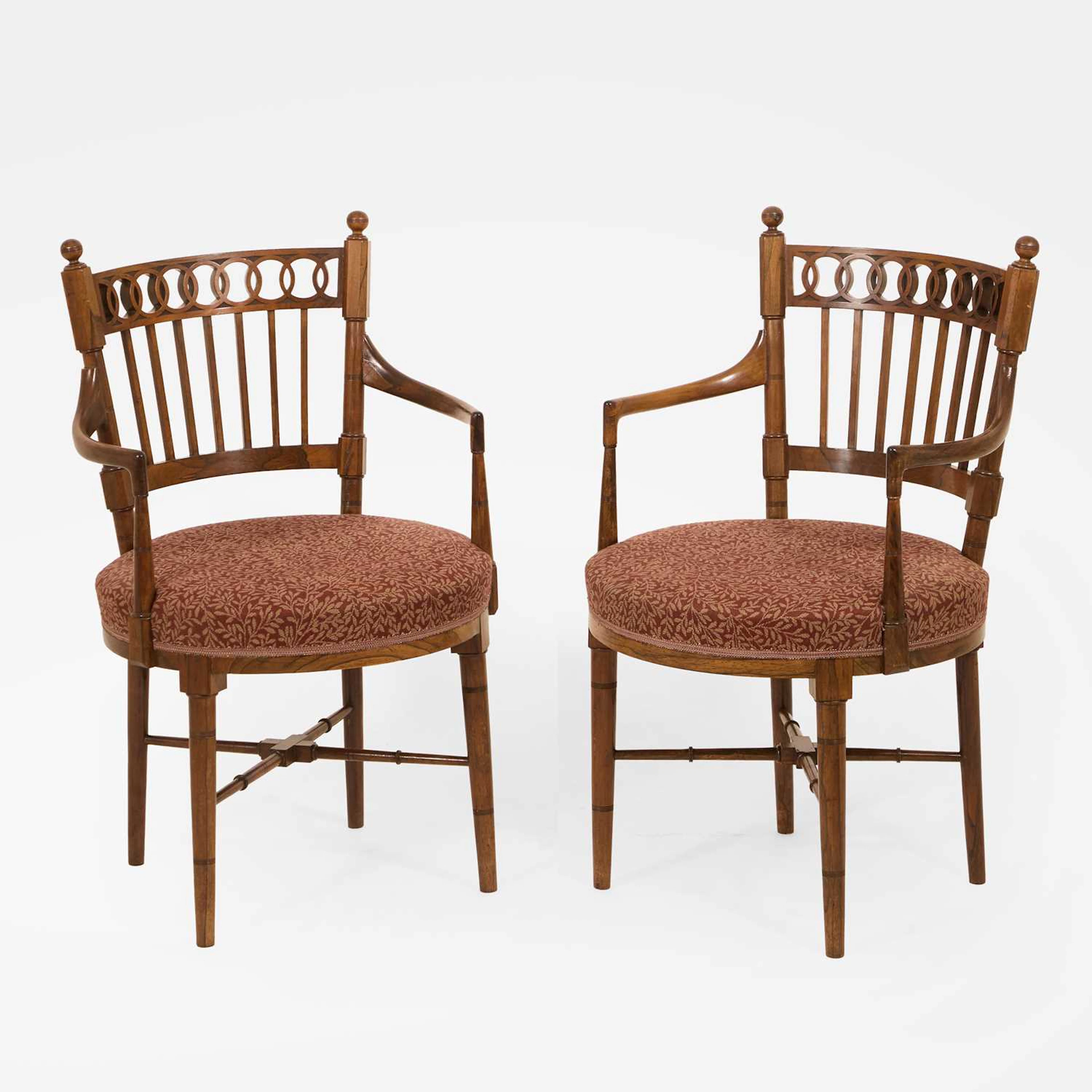 Manner of E W Godwin a pair of rosewood armchairs