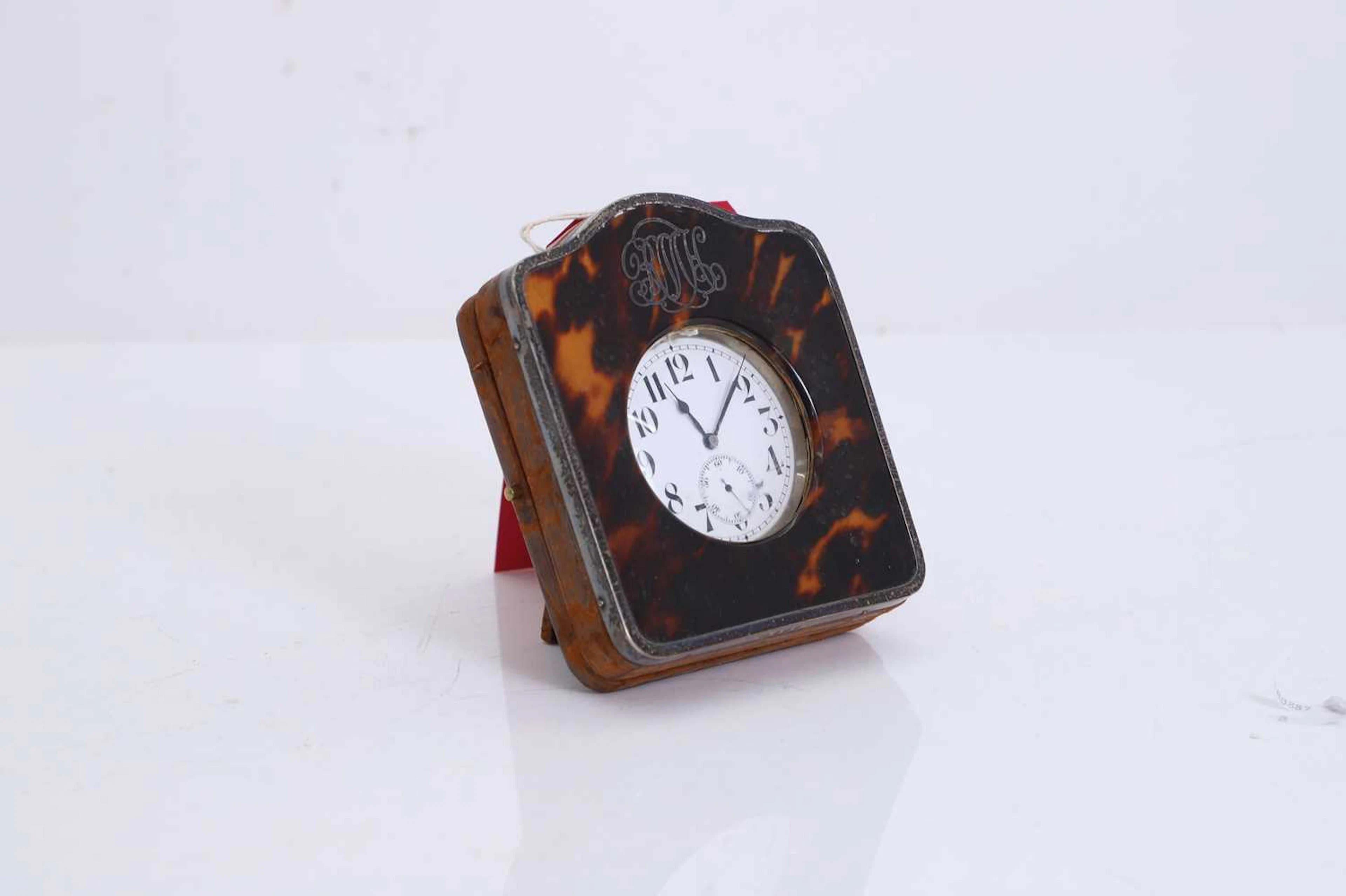 A tortoiseshell and silver mounted travelling timepiece circa 1900