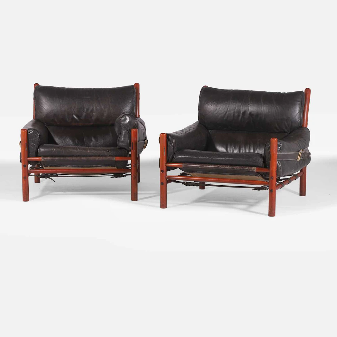 § Arne Norell (Swedish, 1917-1971) a pair of rosewood 'Kontiki' armchairs