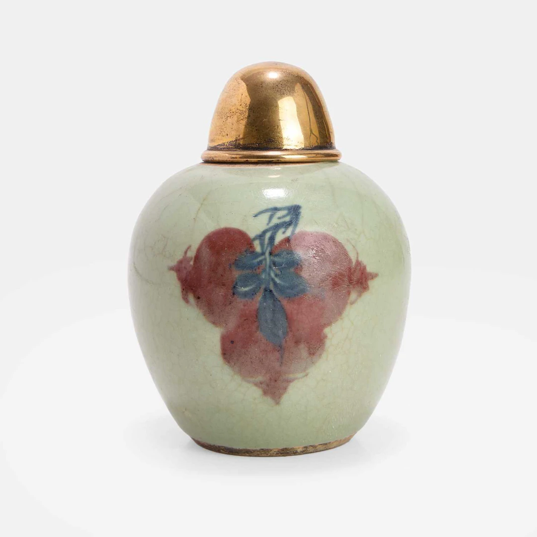 A Chinese underglaze-blue and copper-red decorated celadon jar Kangxi