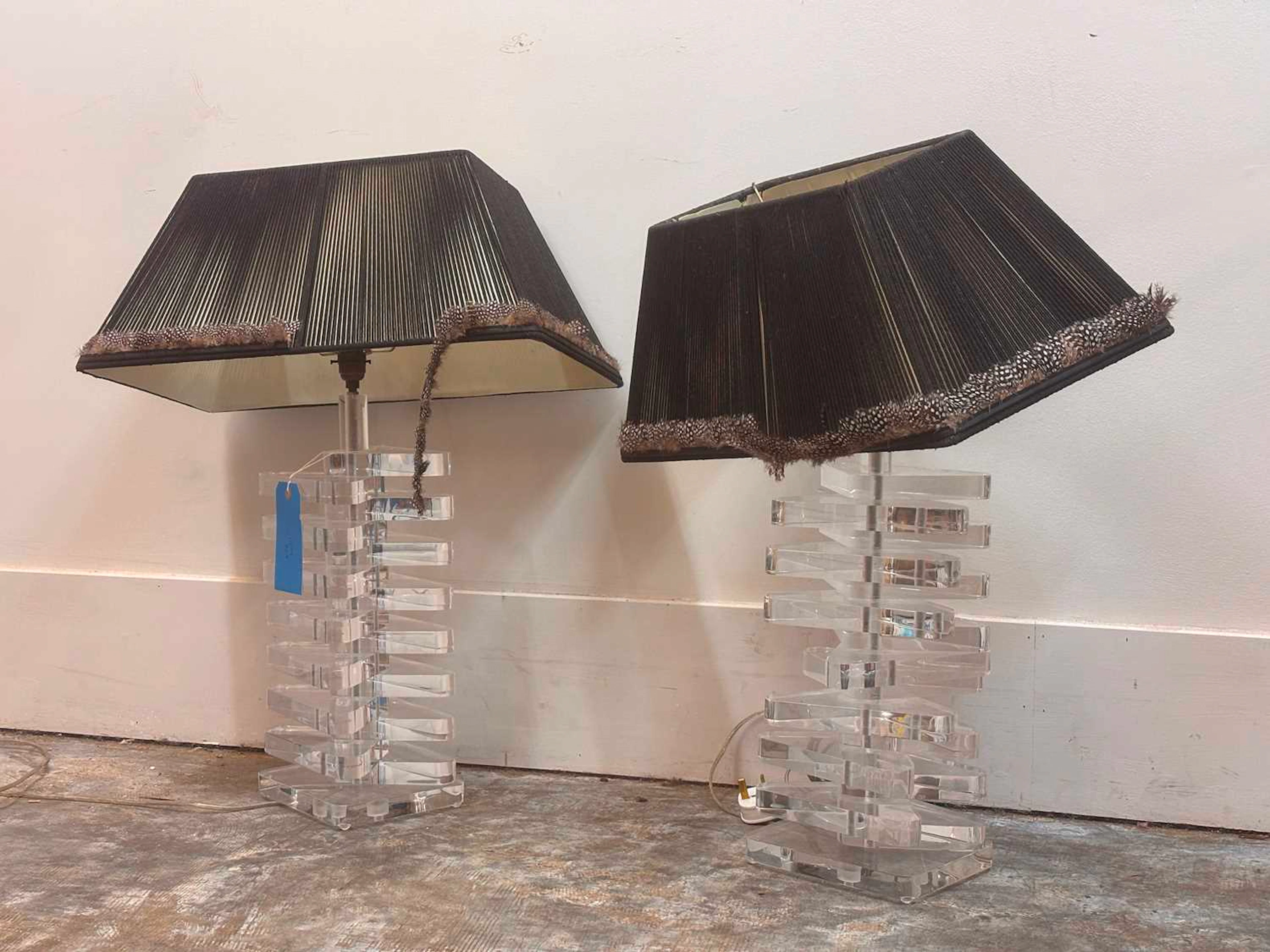A pair of clear Lucite table lamps