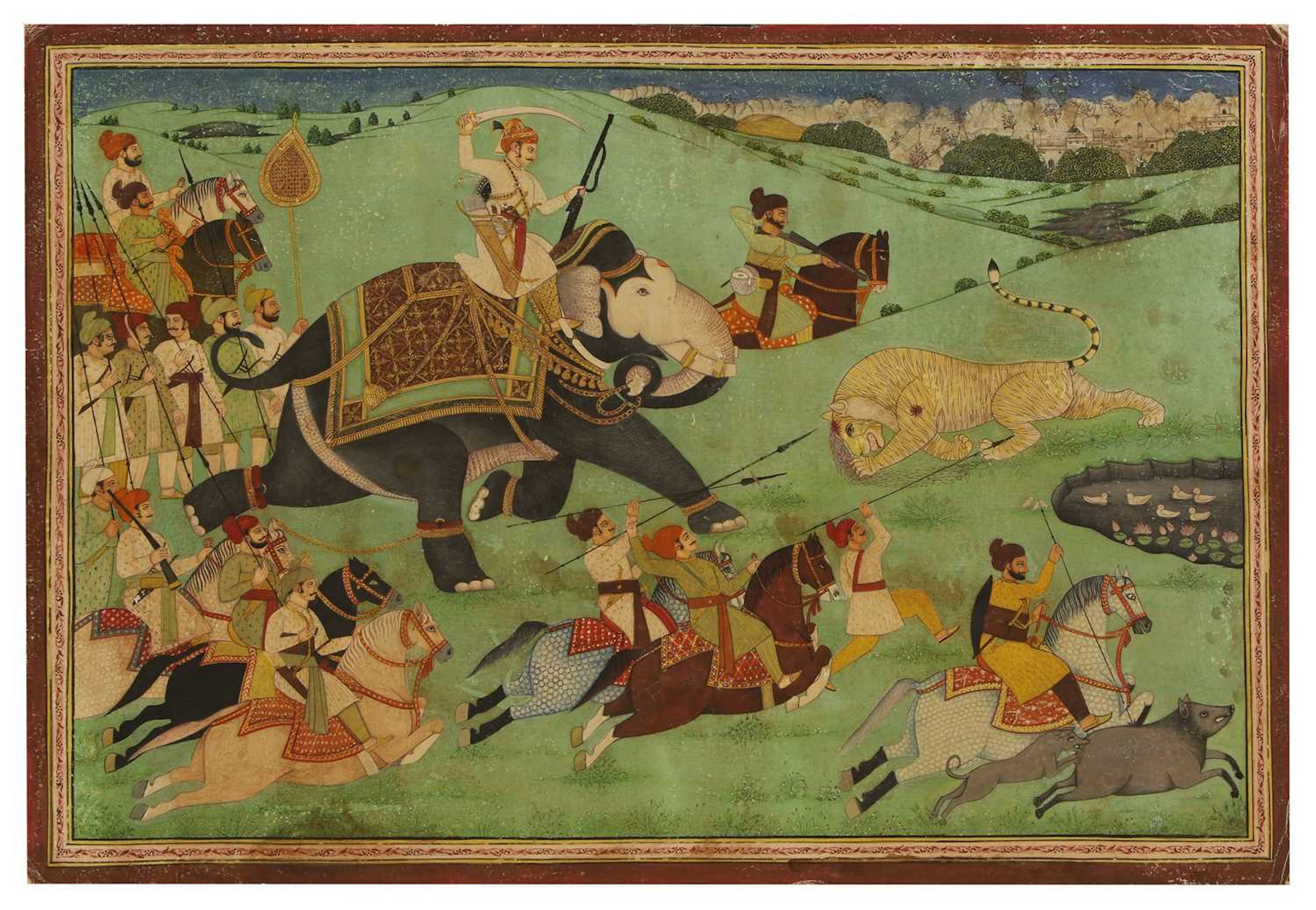A large Indian painting of a maharaja on a tiger hunt
