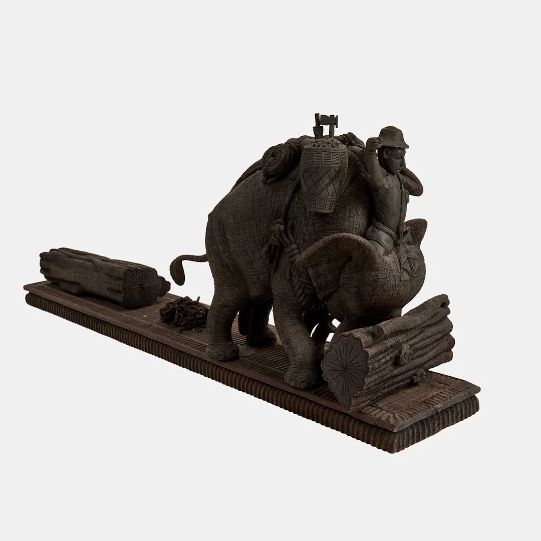 Thai School, 20th century a large carved wood model of a working elephant