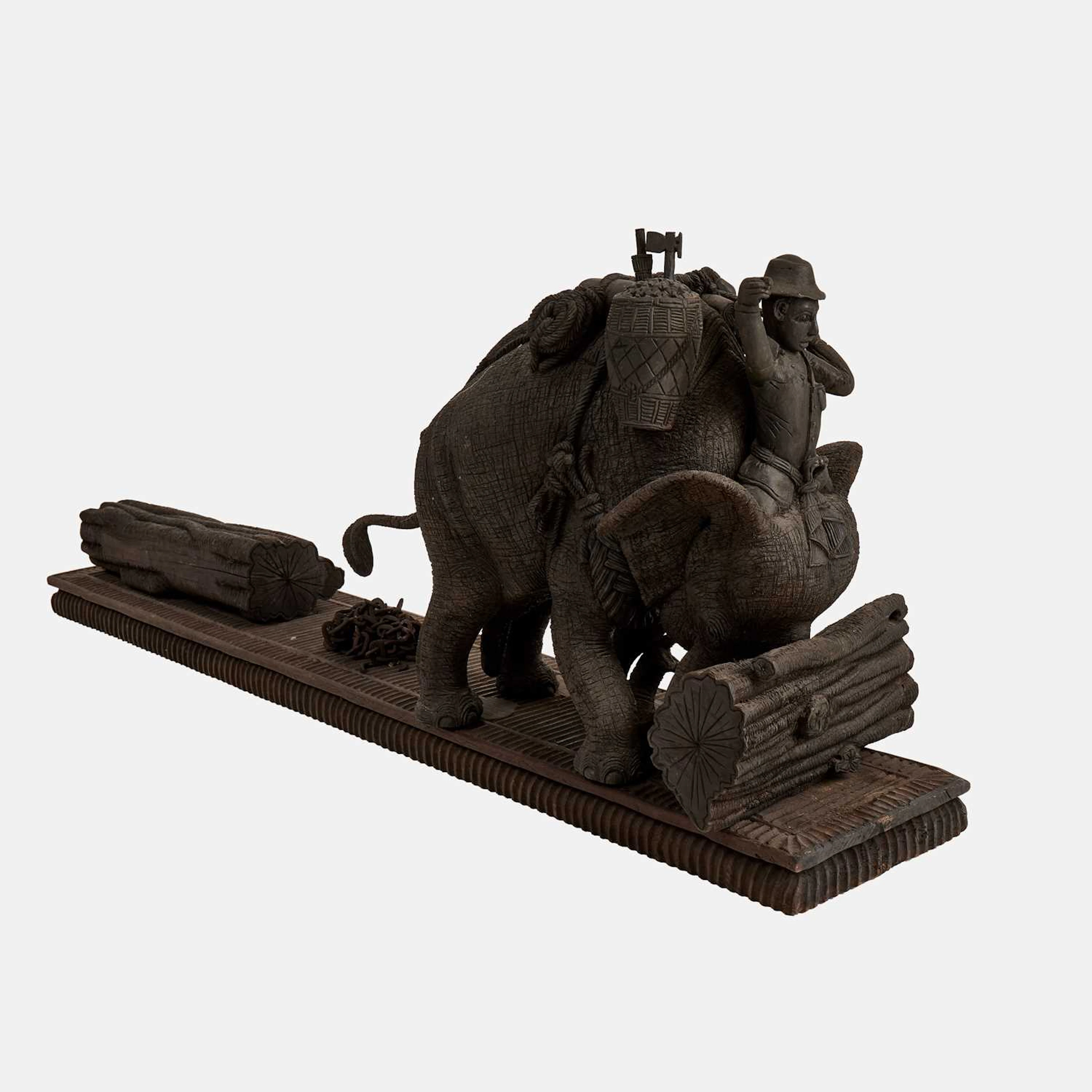 Thai School, 20th century a large carved wood model of a working elephant