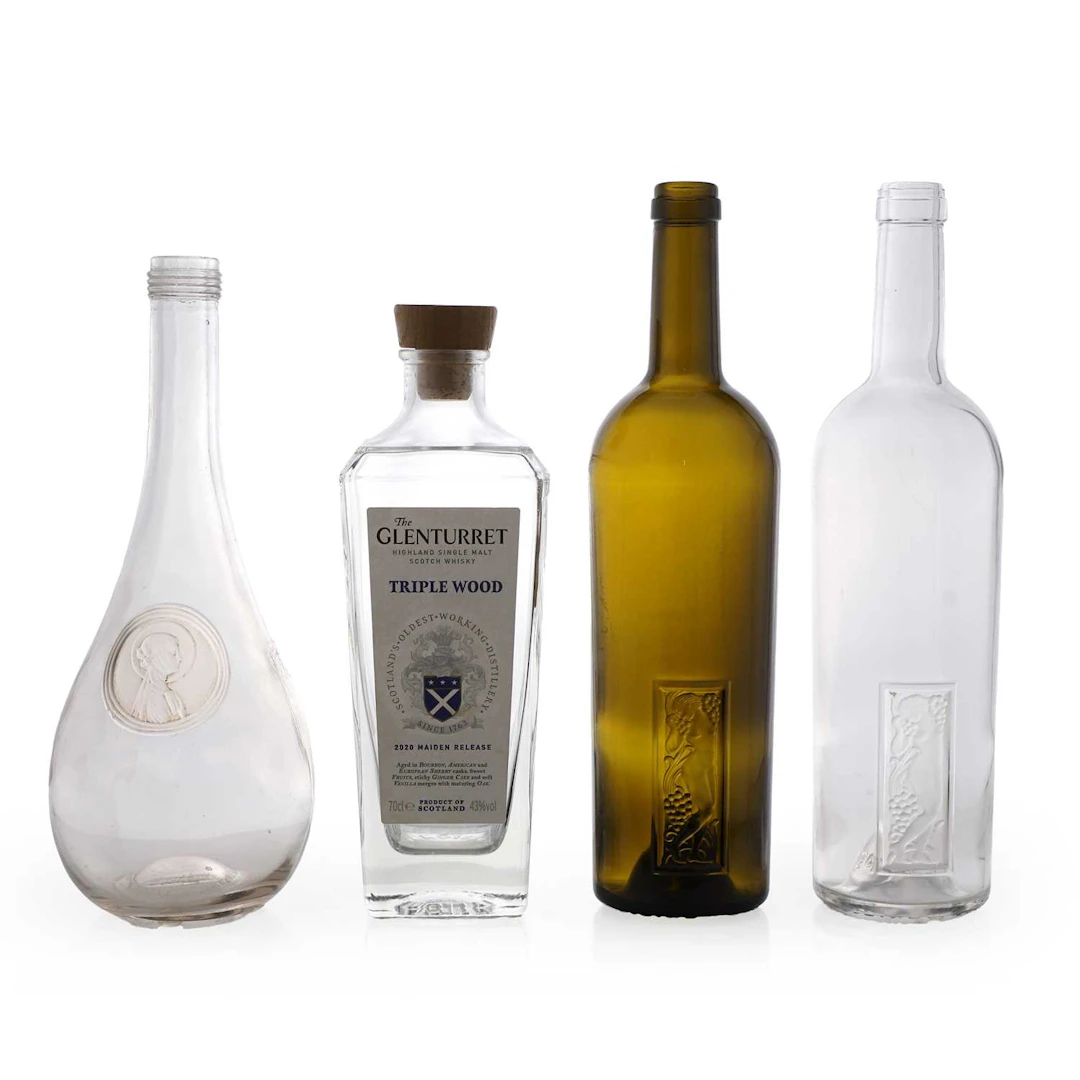 A group of four Lalique glass bottles French