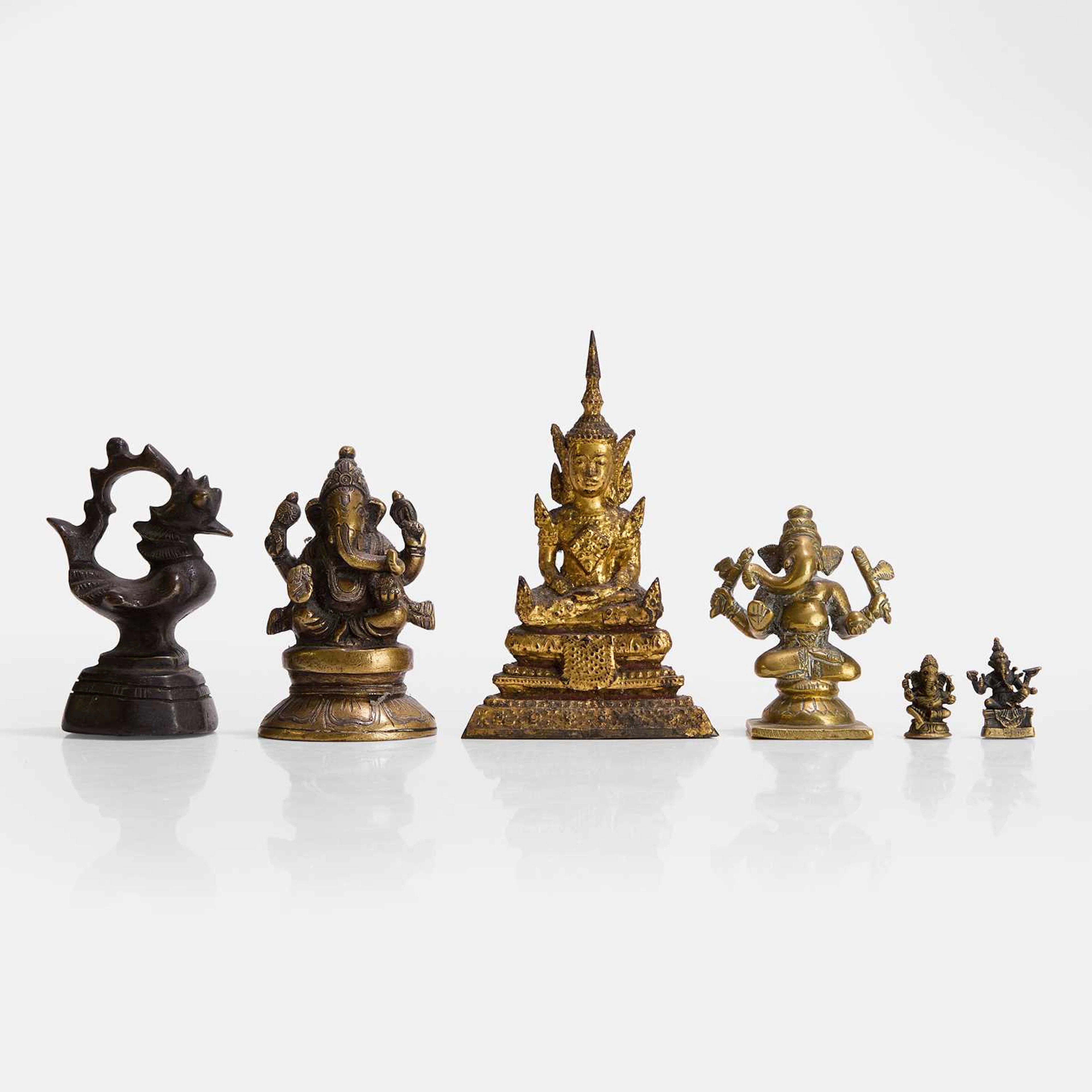 A collection of Indian miniature brass figures of Ganesh 20th century
