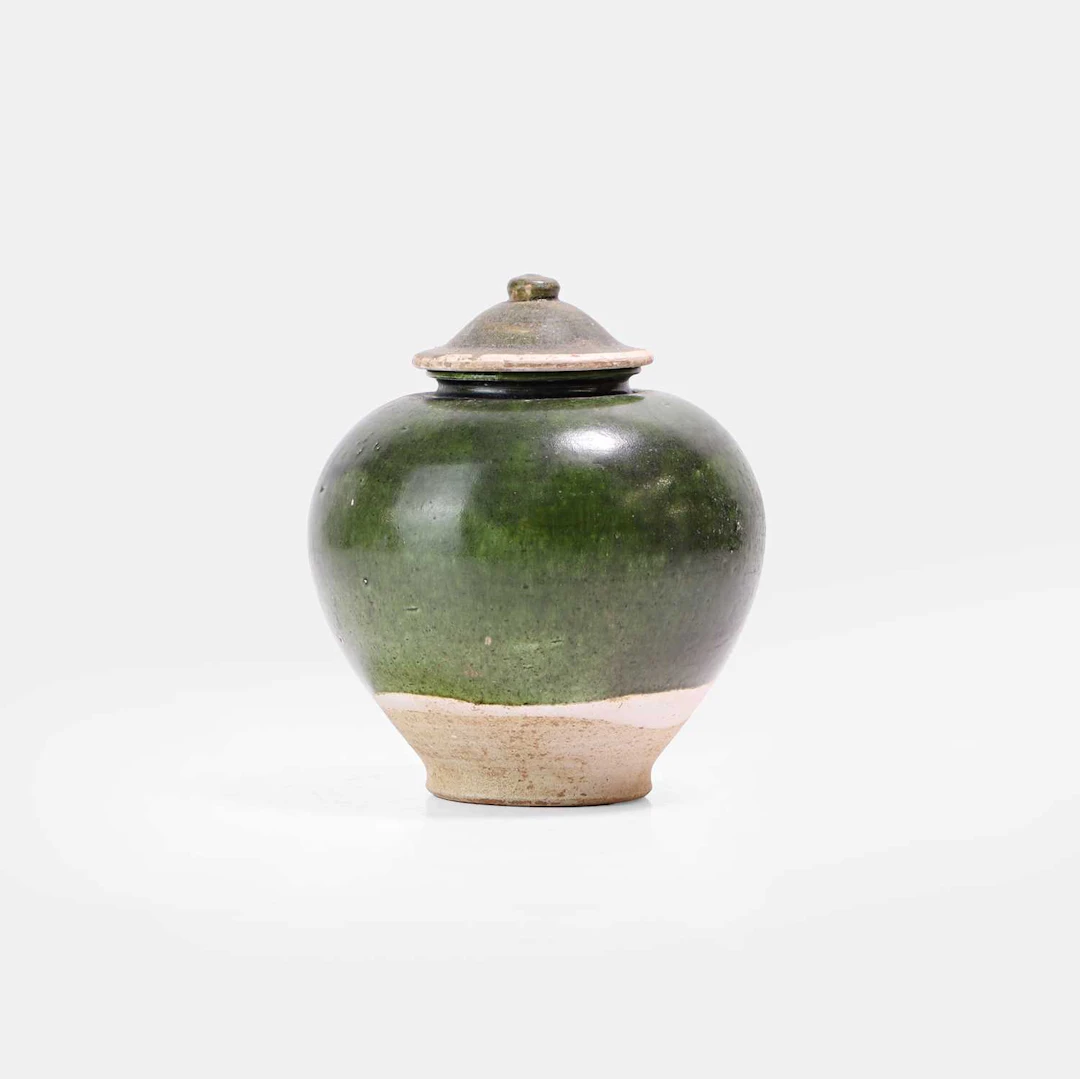 A Chinese earthenware jar and cover Tang dynasty (618-907)