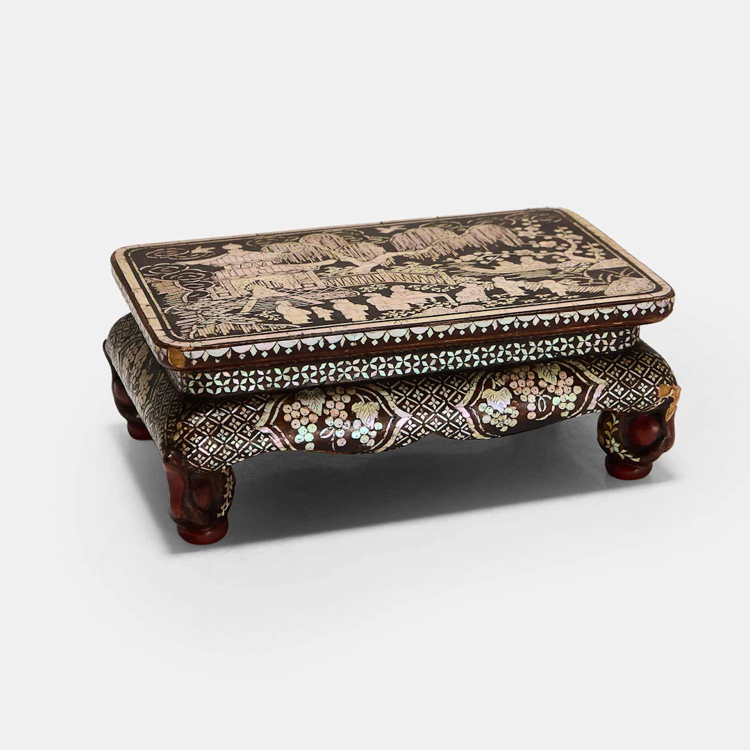 A small Chinese mother-of-pearl-inlaid black lacquer stand Qing dynasty