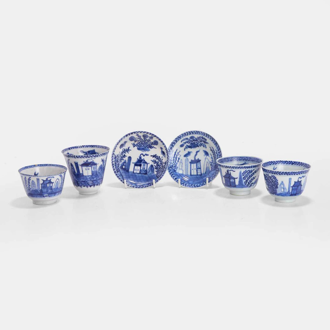 A collection of Chinese blue and white cups and saucers 18th century