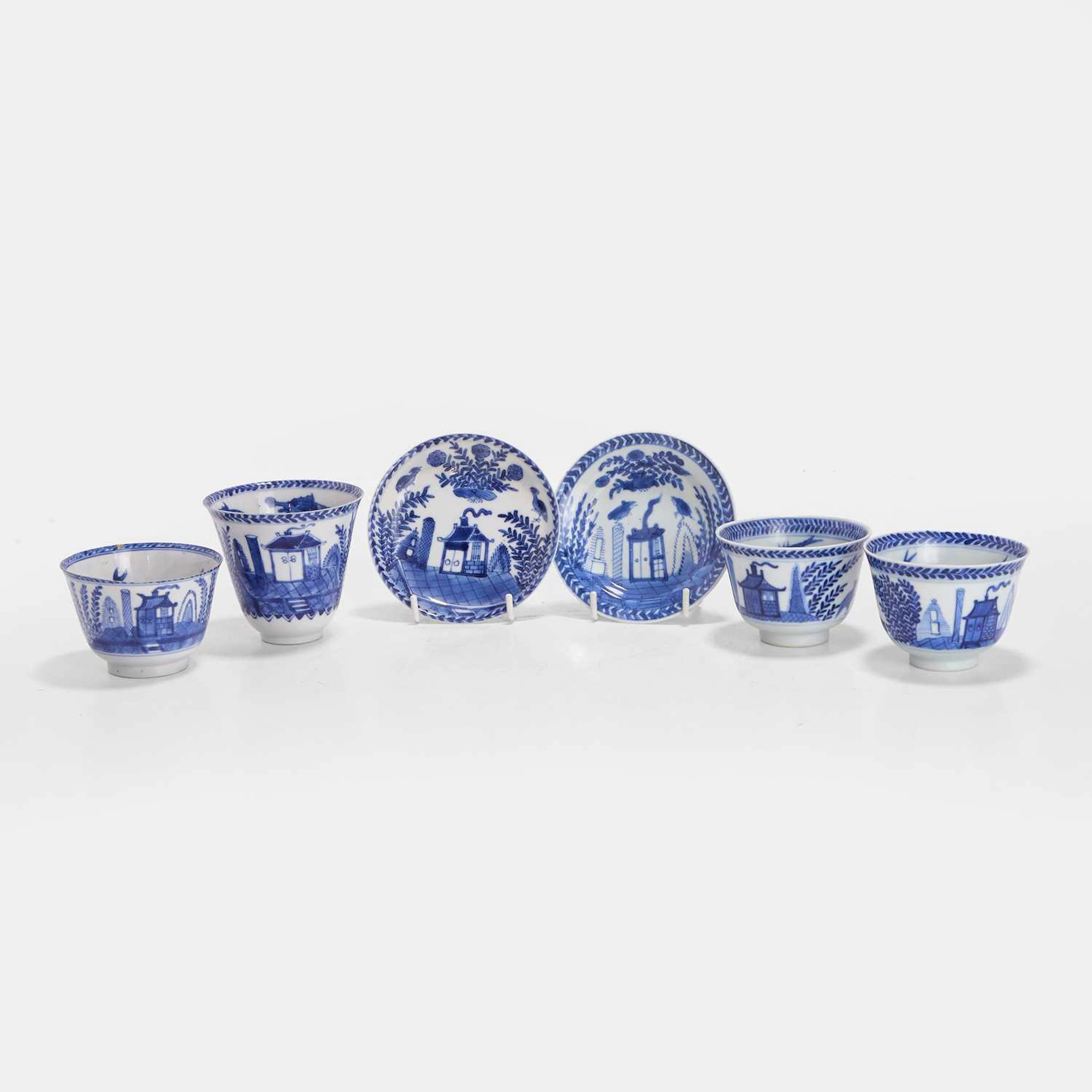 A collection of Chinese blue and white cups and saucers 18th century