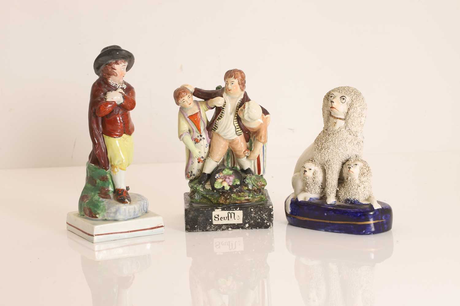 Three Staffordshire pottery figures 19th century
