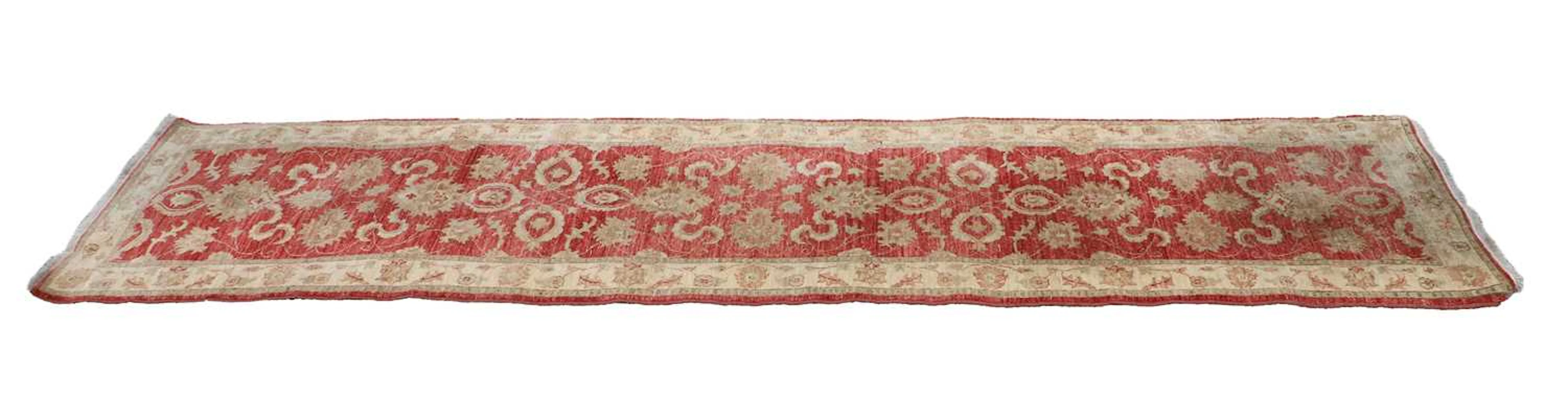 A hand knotted Agra red ground runner