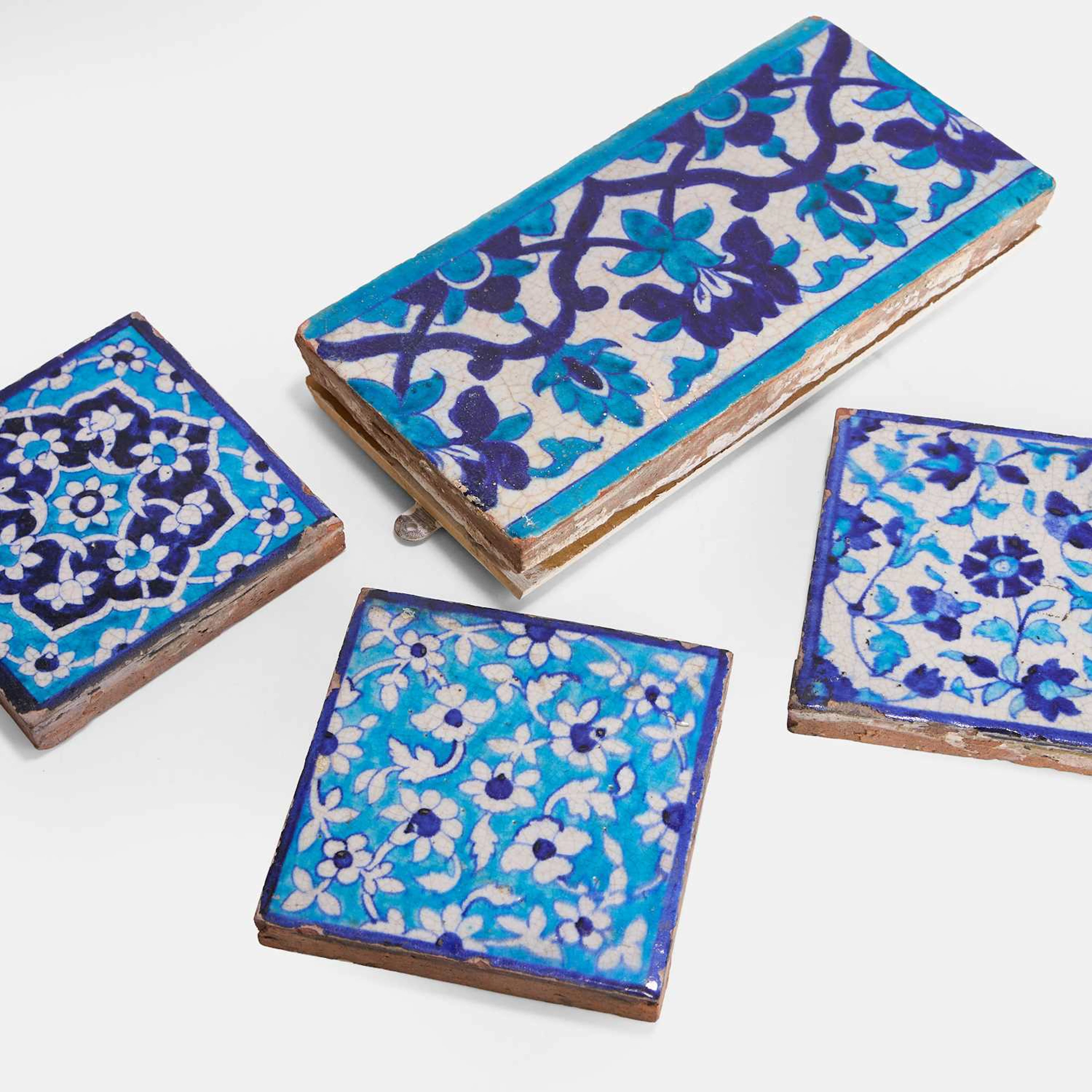 A collection of four Multan cobalt-blue and turquoise-glazed pottery