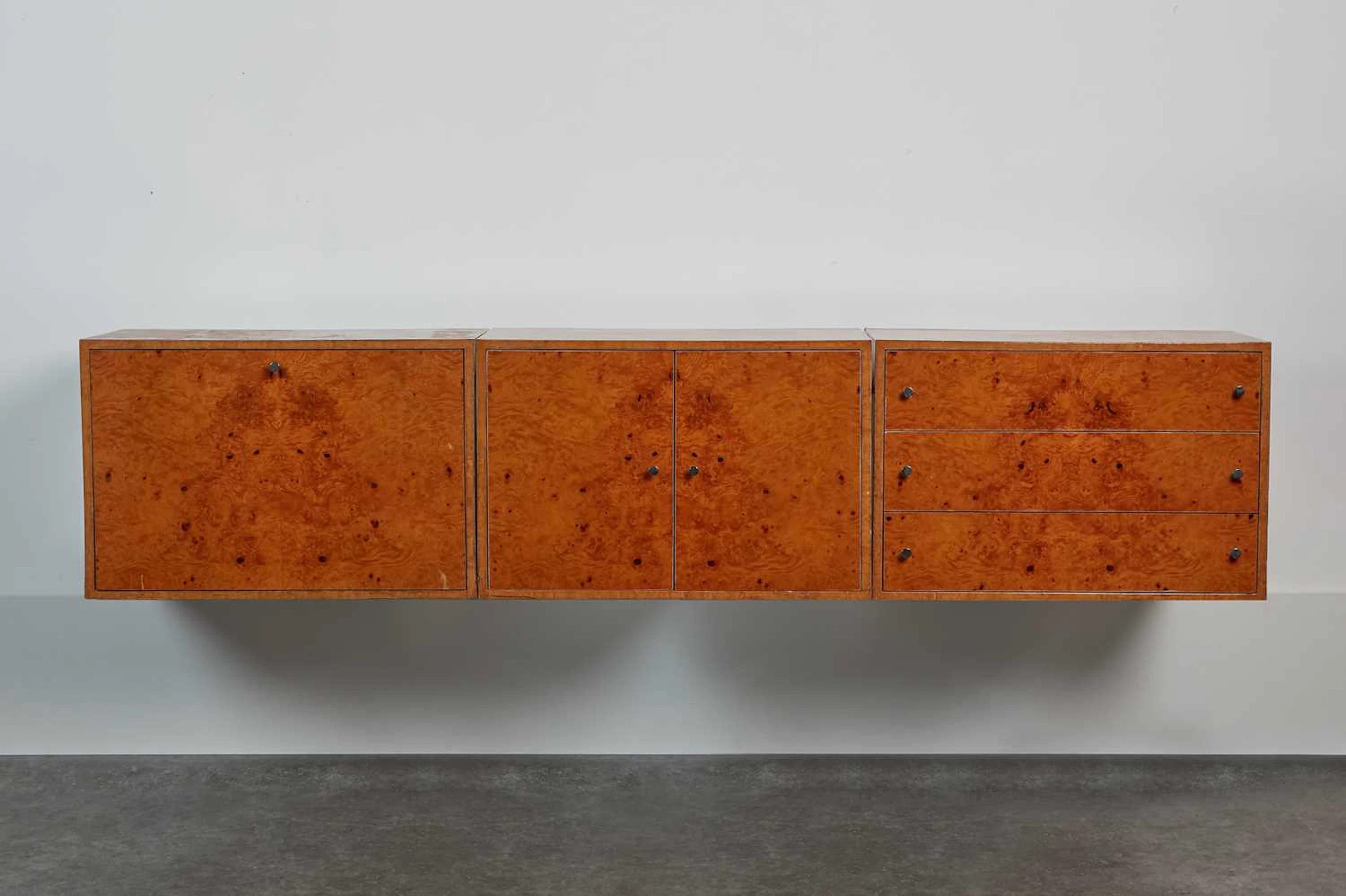 Three lacquered burrwood cabinets