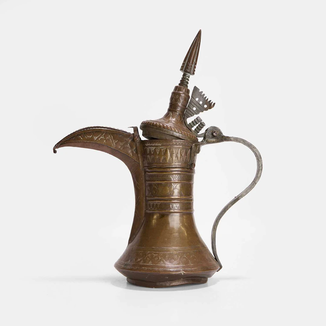 An Omani brass coffee pot 19th century, the Sultanate of Oman