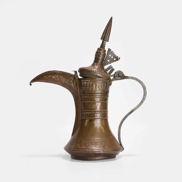 An Omani brass coffee pot 19th century, the Sultanate of Oman