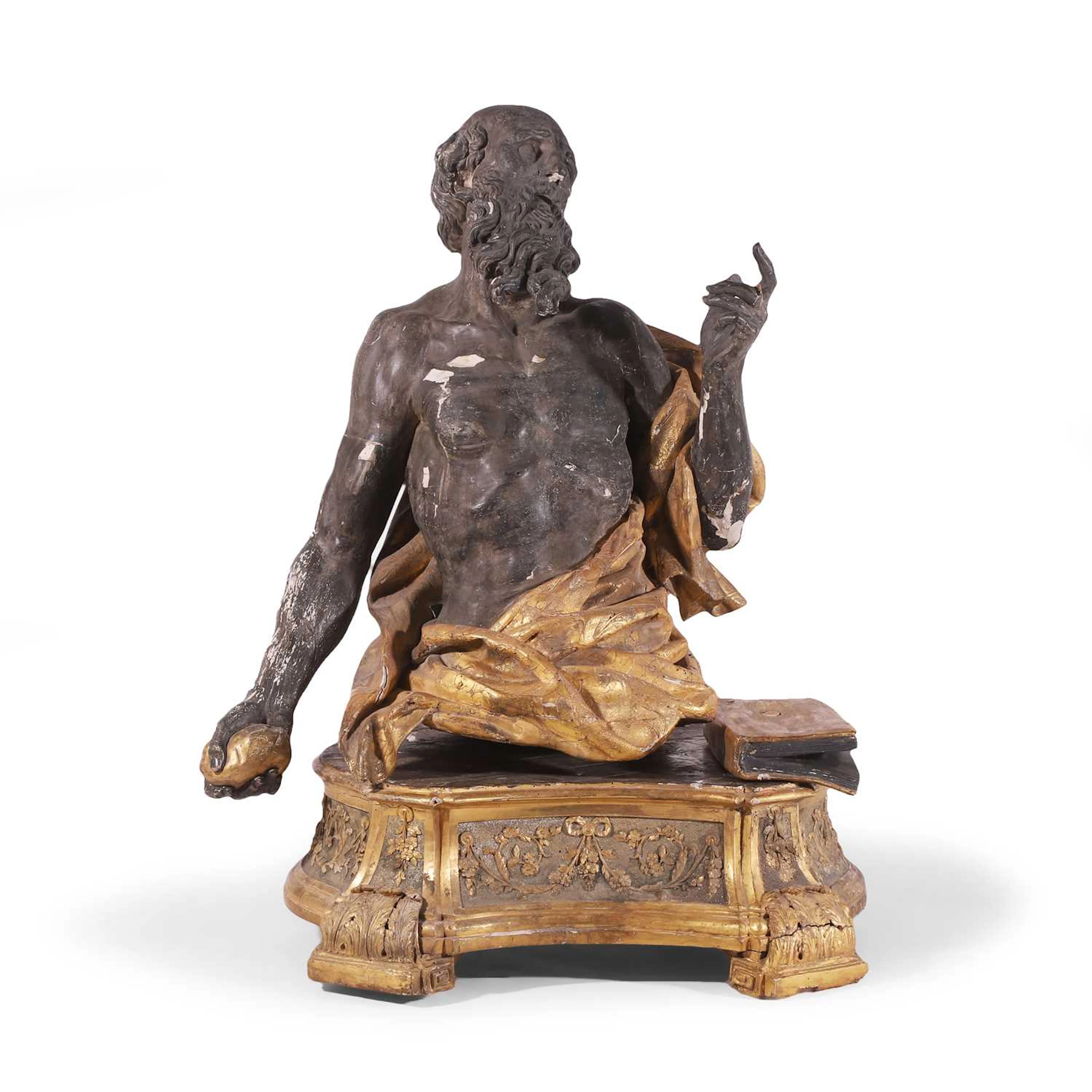 A carved wooden, ebonised and parcel-gilt figure of Saint Jerome 18th