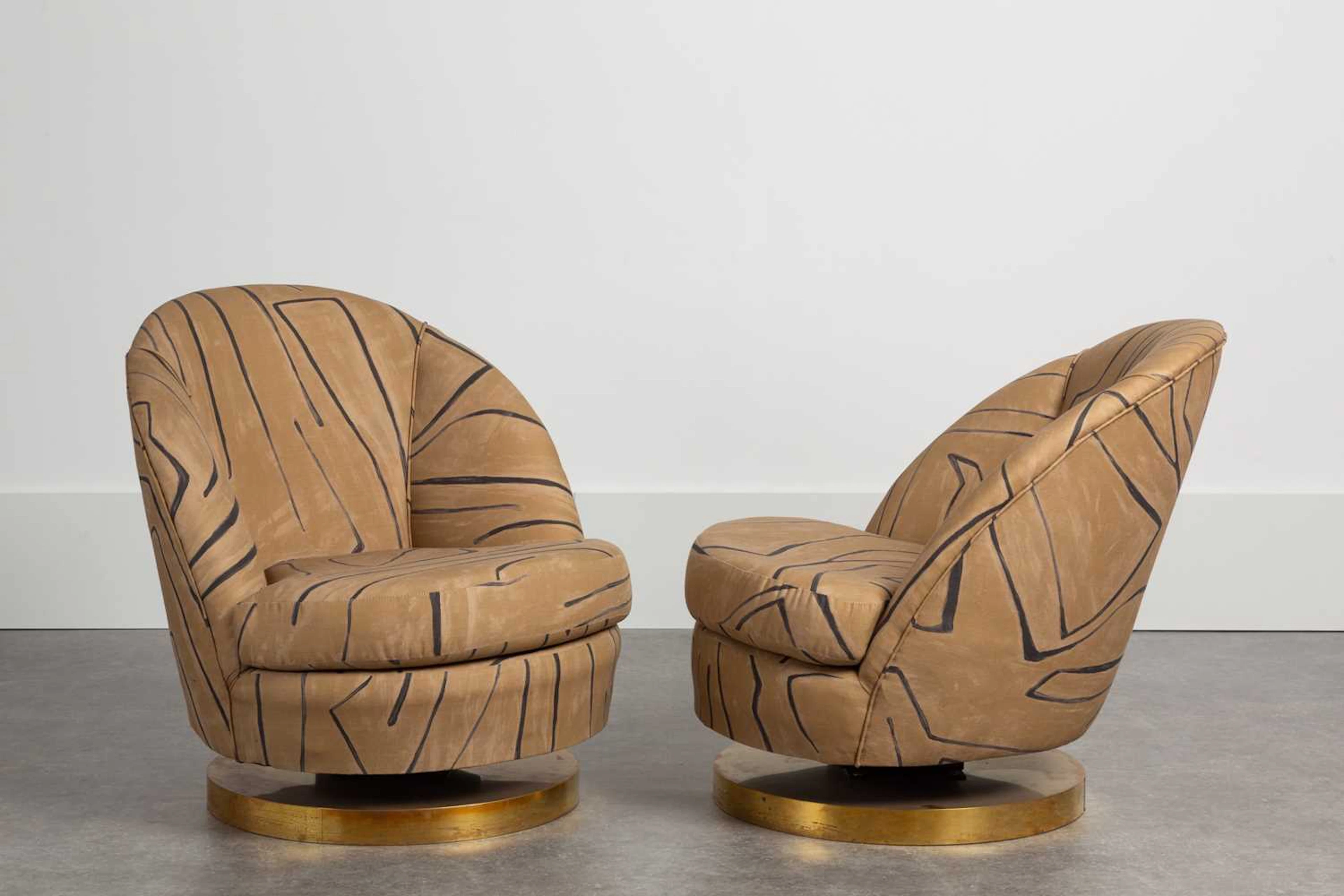 A pair of upholstered tub chairs