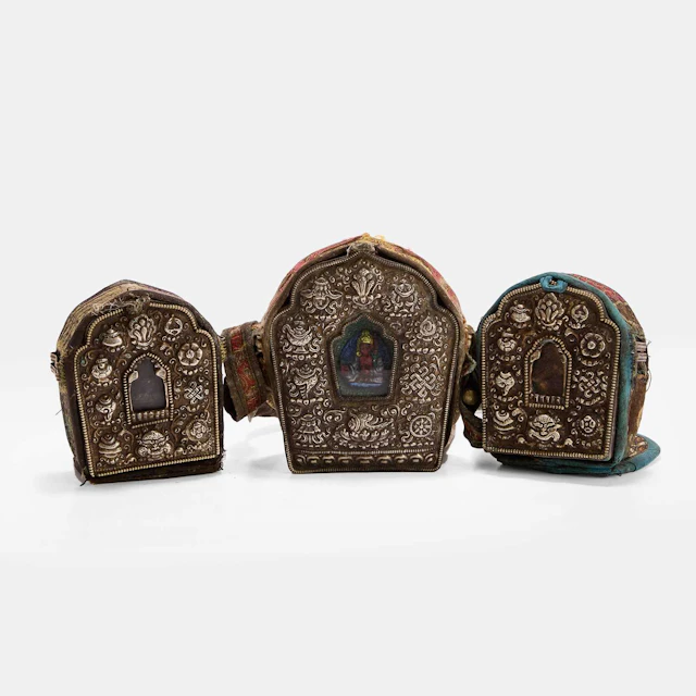 Three Tibetan white-metal alloy portable gau shrines 19th century