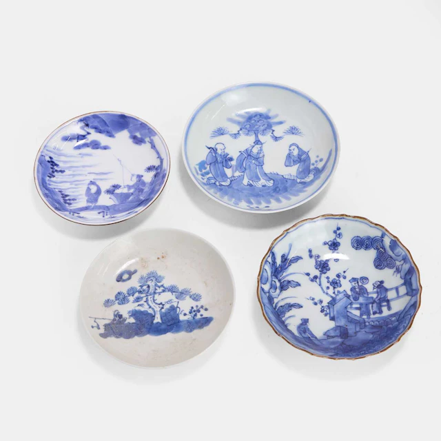 A collection of four Japanese blue and white saucers 18th-19th century