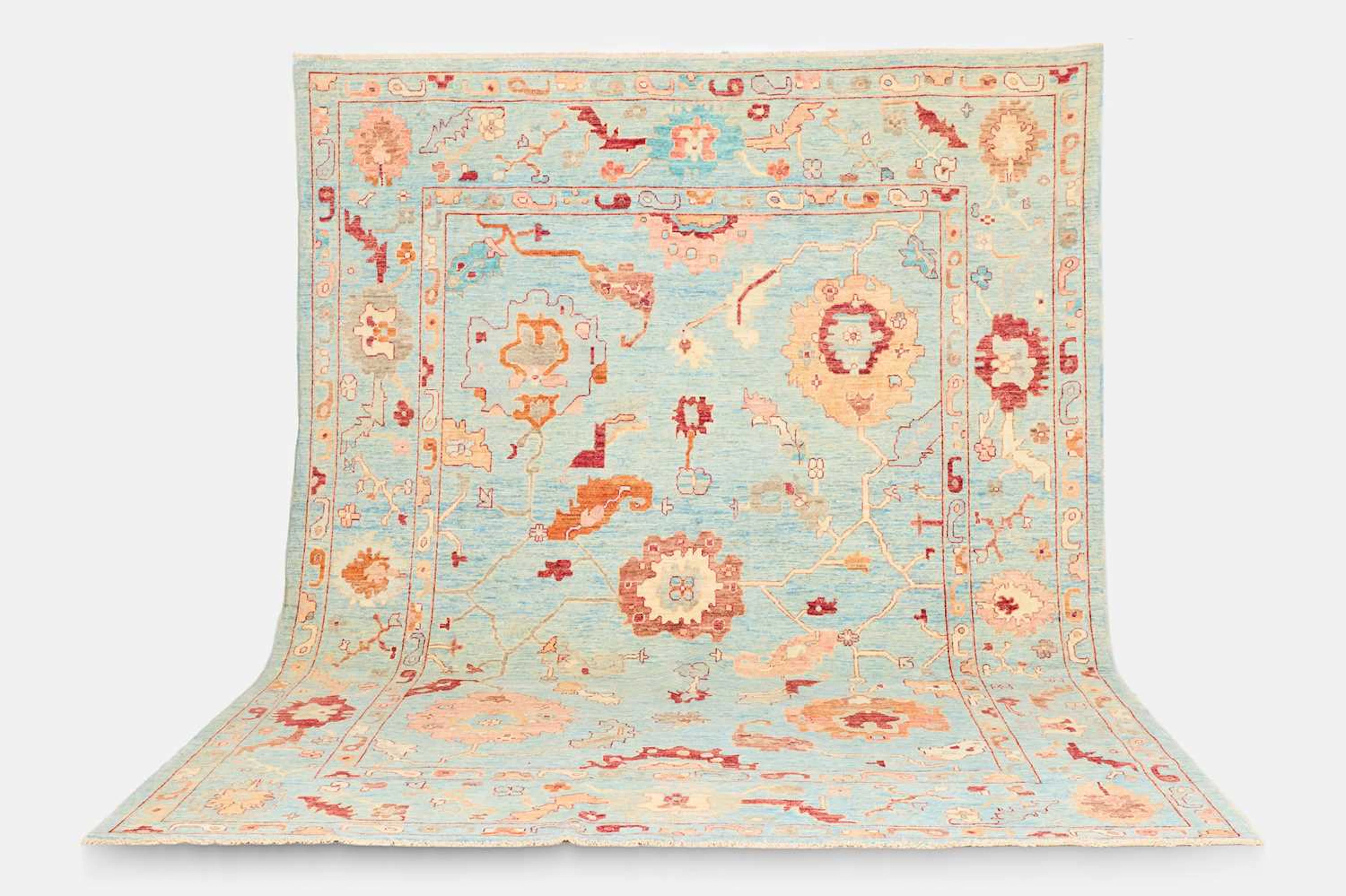 An Oushak wool carpet of recent manufacture