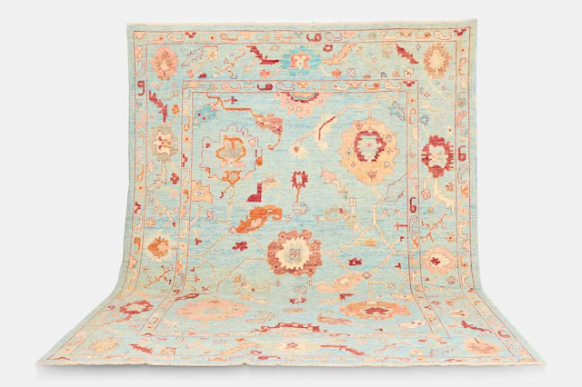 An Oushak wool carpet of recent manufacture