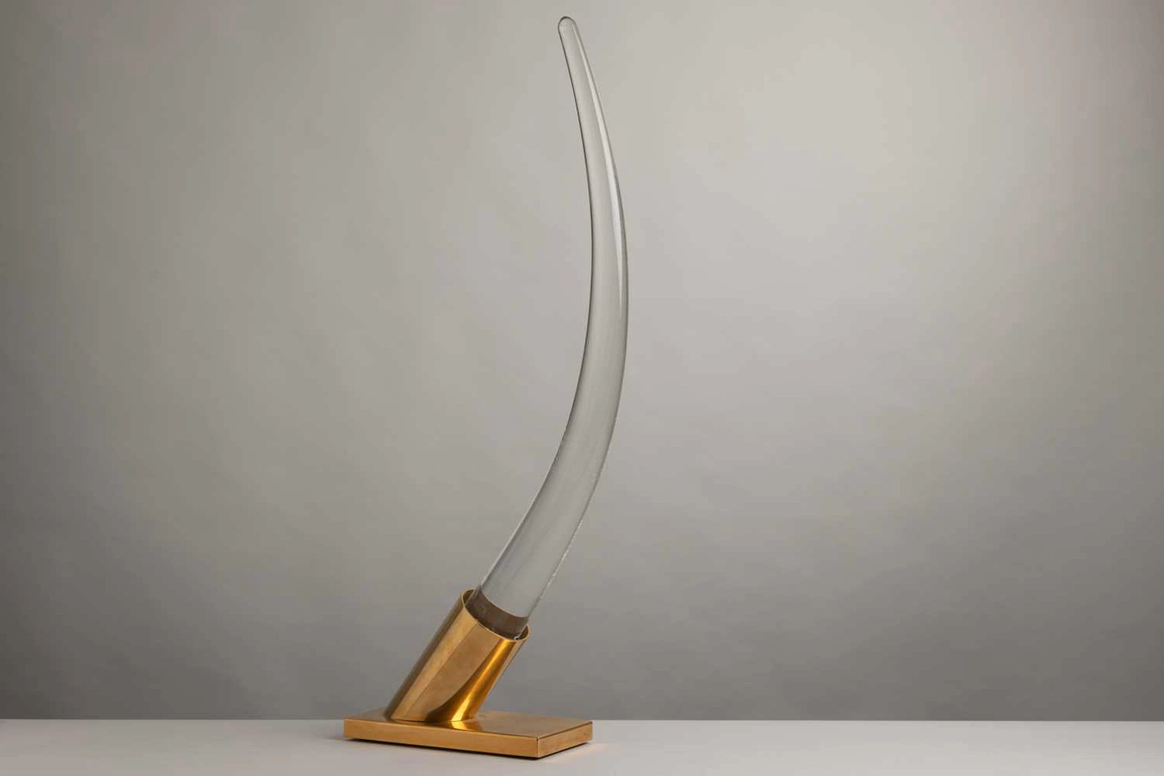 A large Lucite sculptural 'tusk' table lamp
