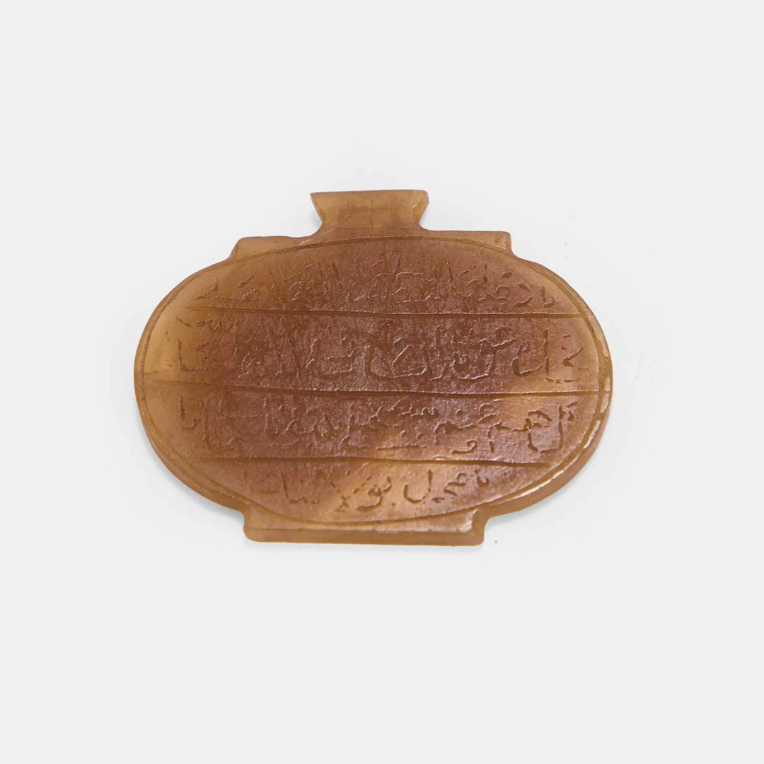 A Persian carved hardstone pendant late 19th/early 20th century, Iran