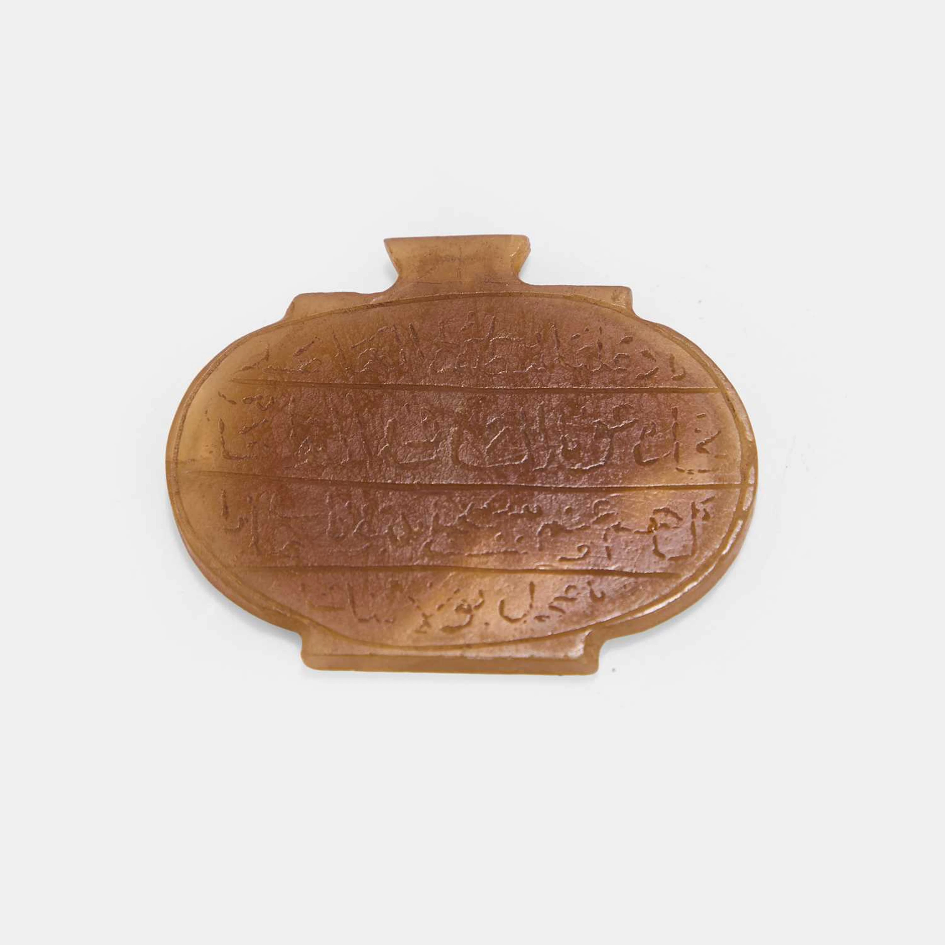 A Persian carved hardstone pendant late 19th/early 20th century, Iran