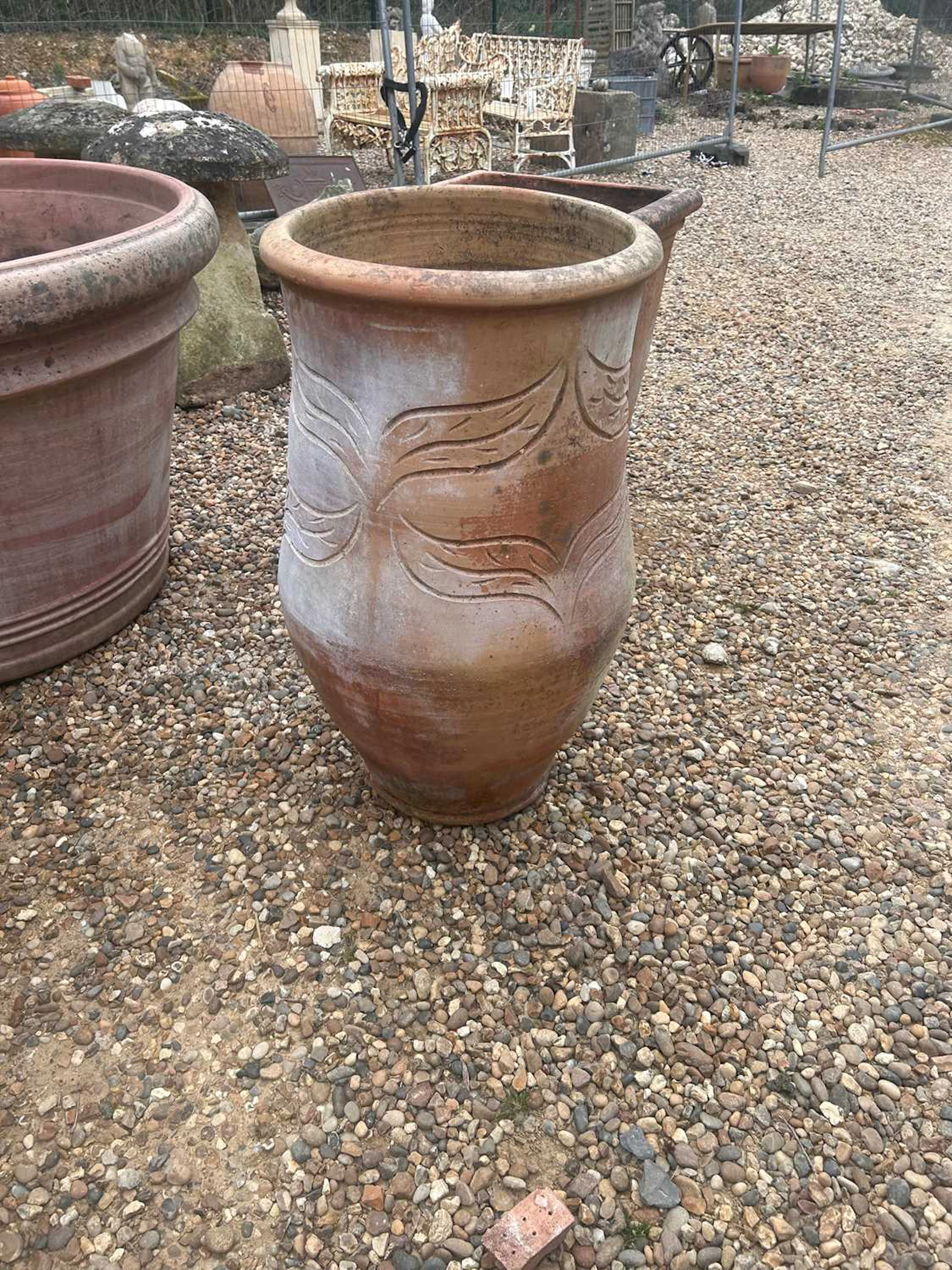 A large terracotta garden planter