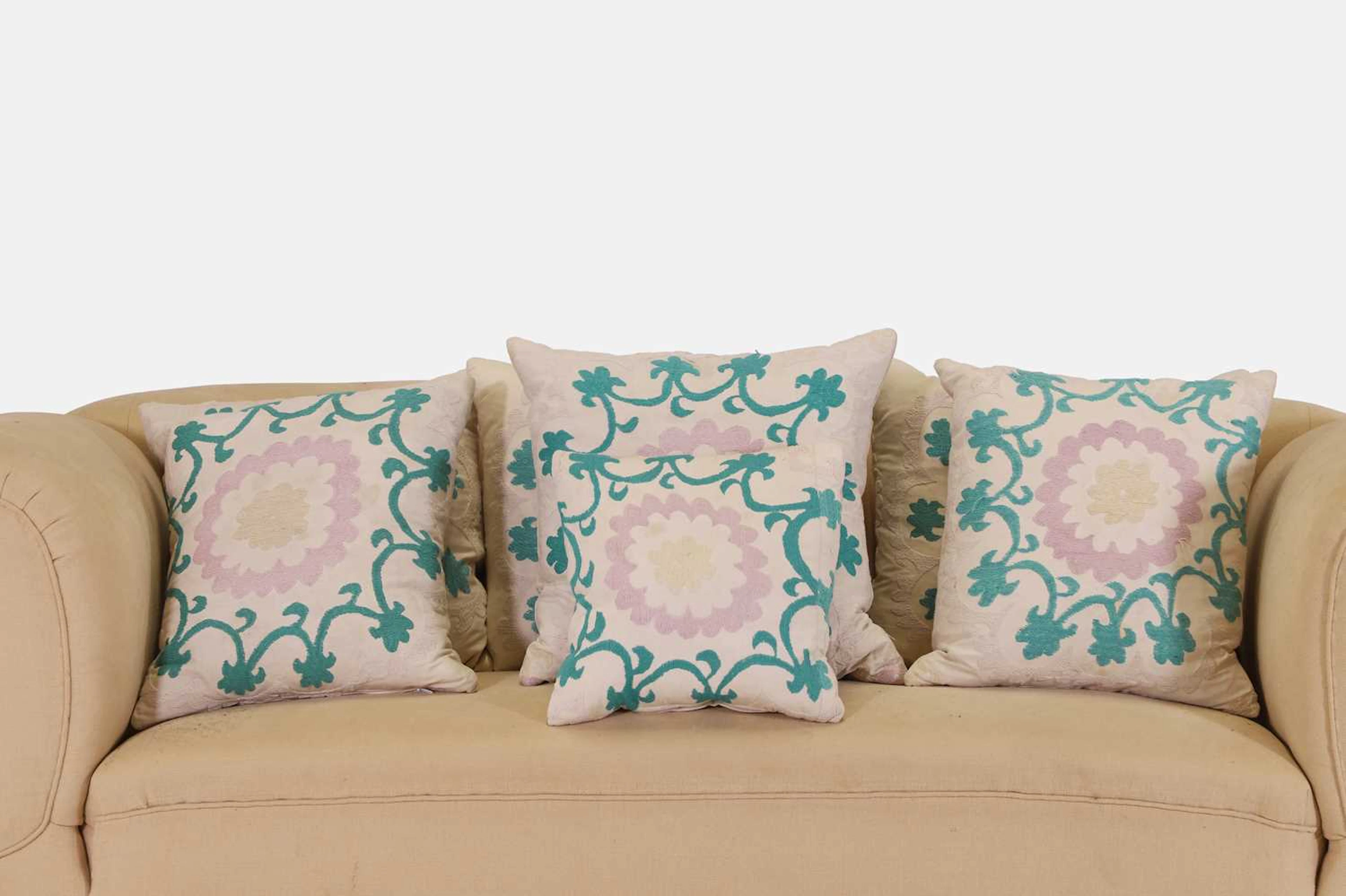 Seven suzani cushions of recent manufacture