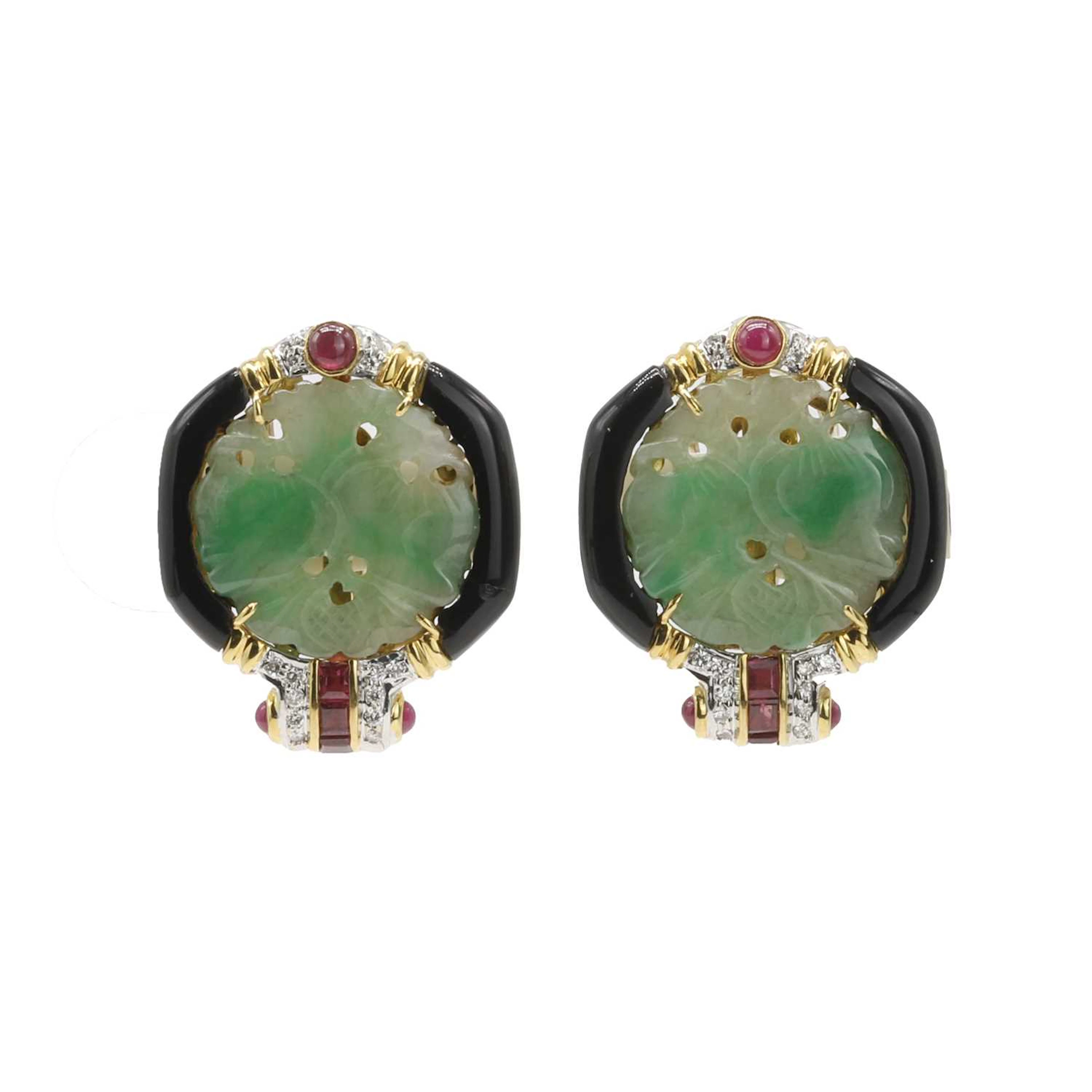 A pair of carved jade, onyx, ruby and diamond clip-on earrings