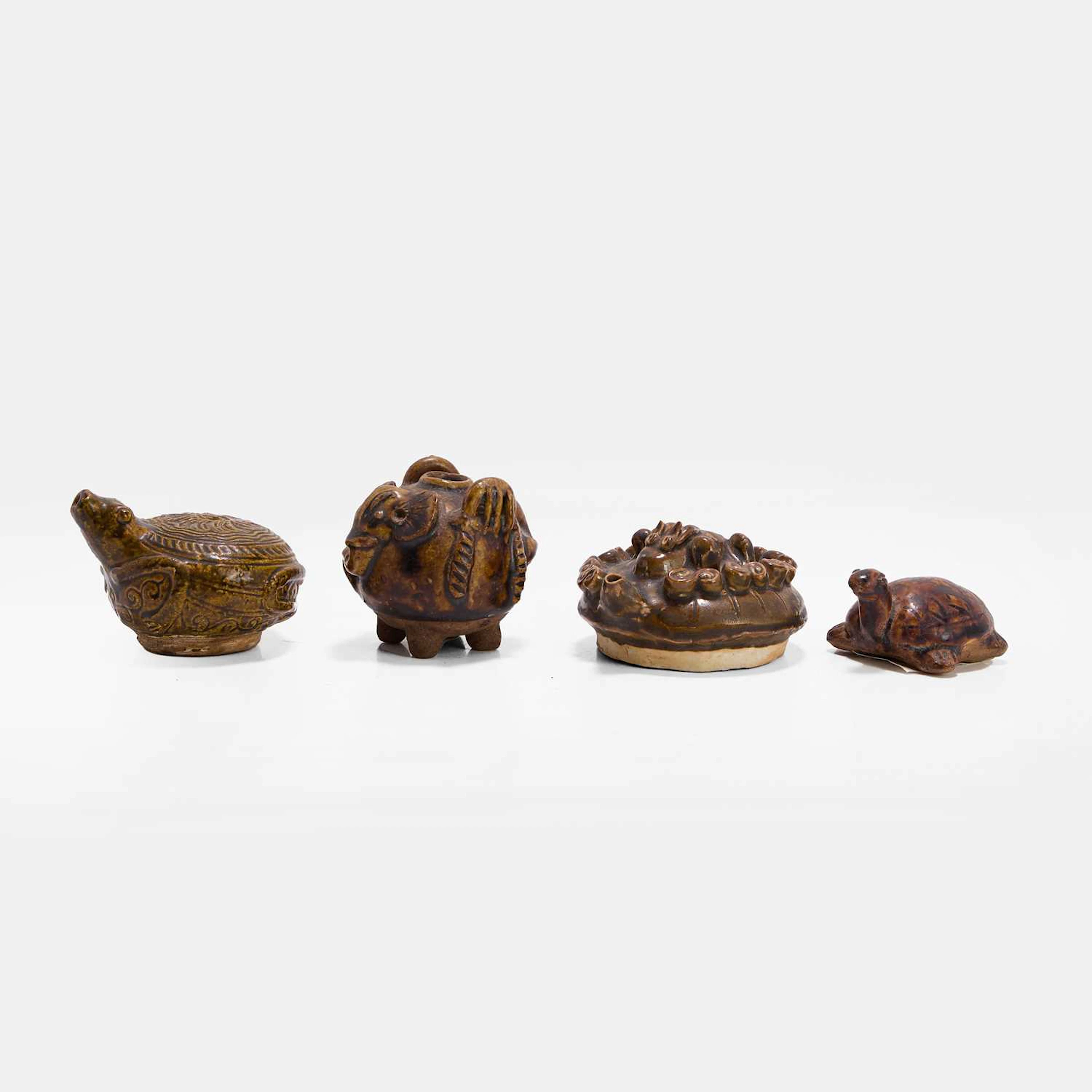 A collection of four Southeast Asian earthenware water droppers 15th-17th