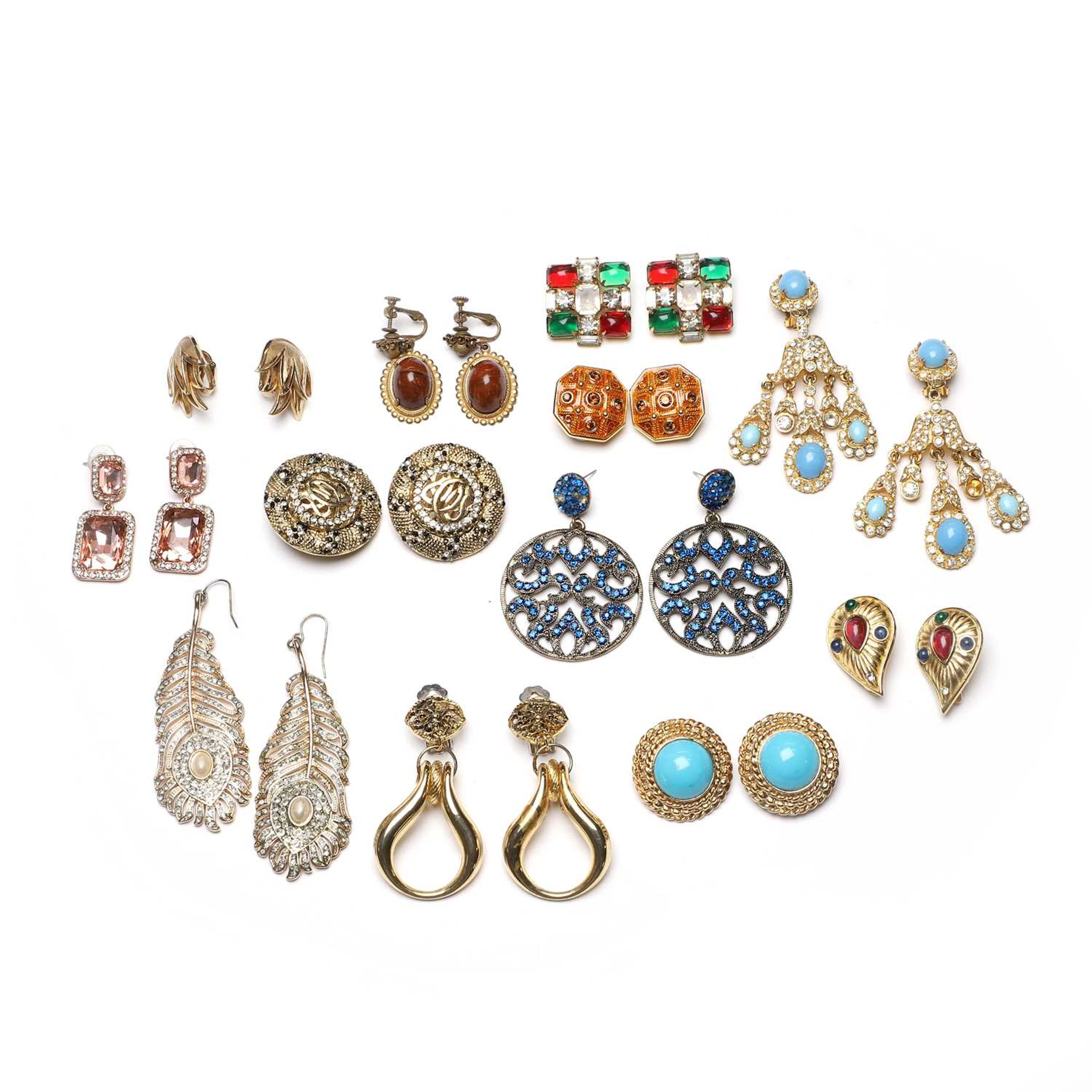 A collection of vintage designer costume earrings