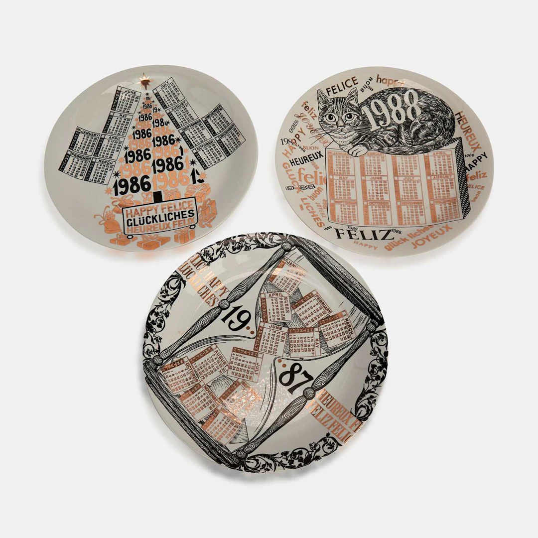 Fornasetti a group of three plates