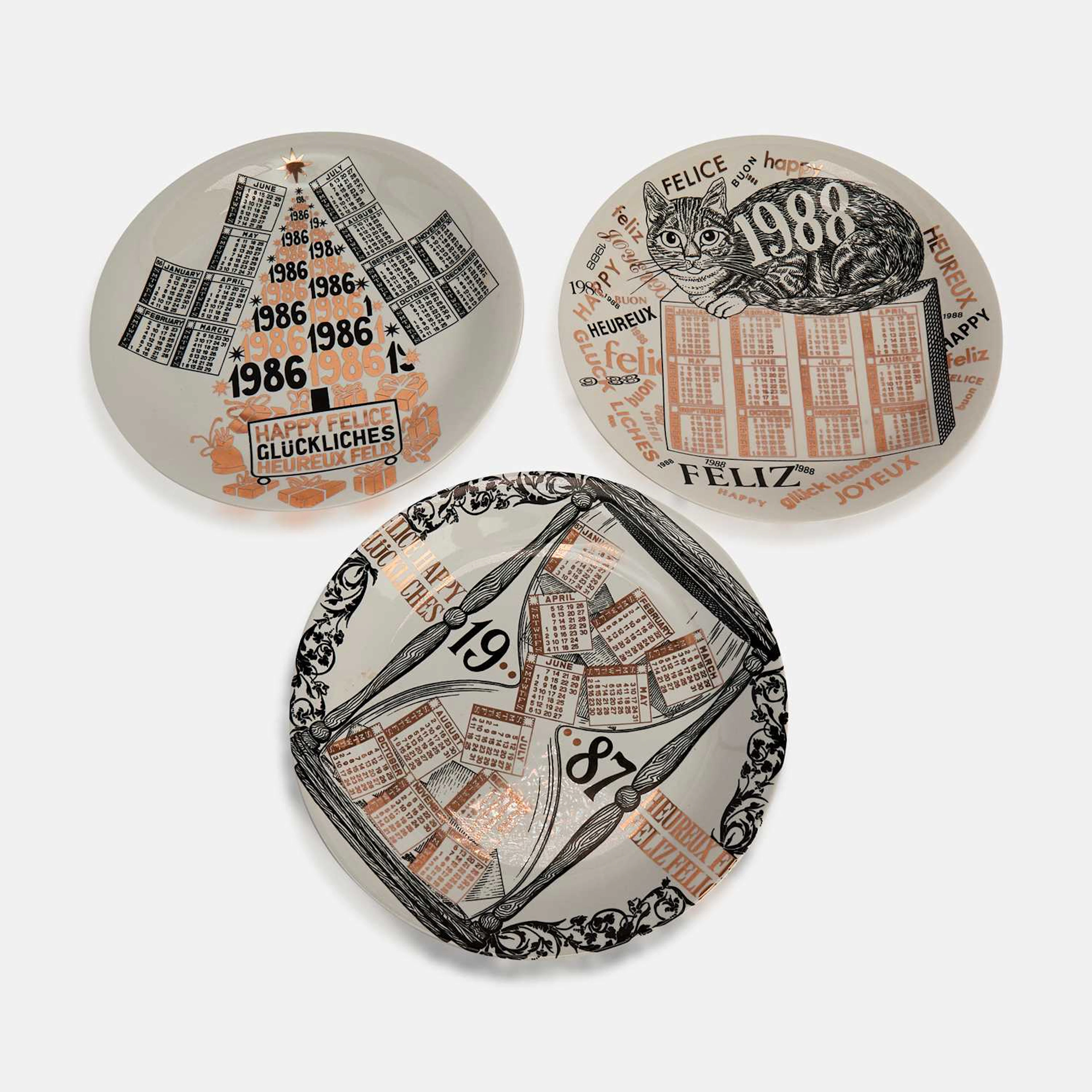 Fornasetti a group of three plates
