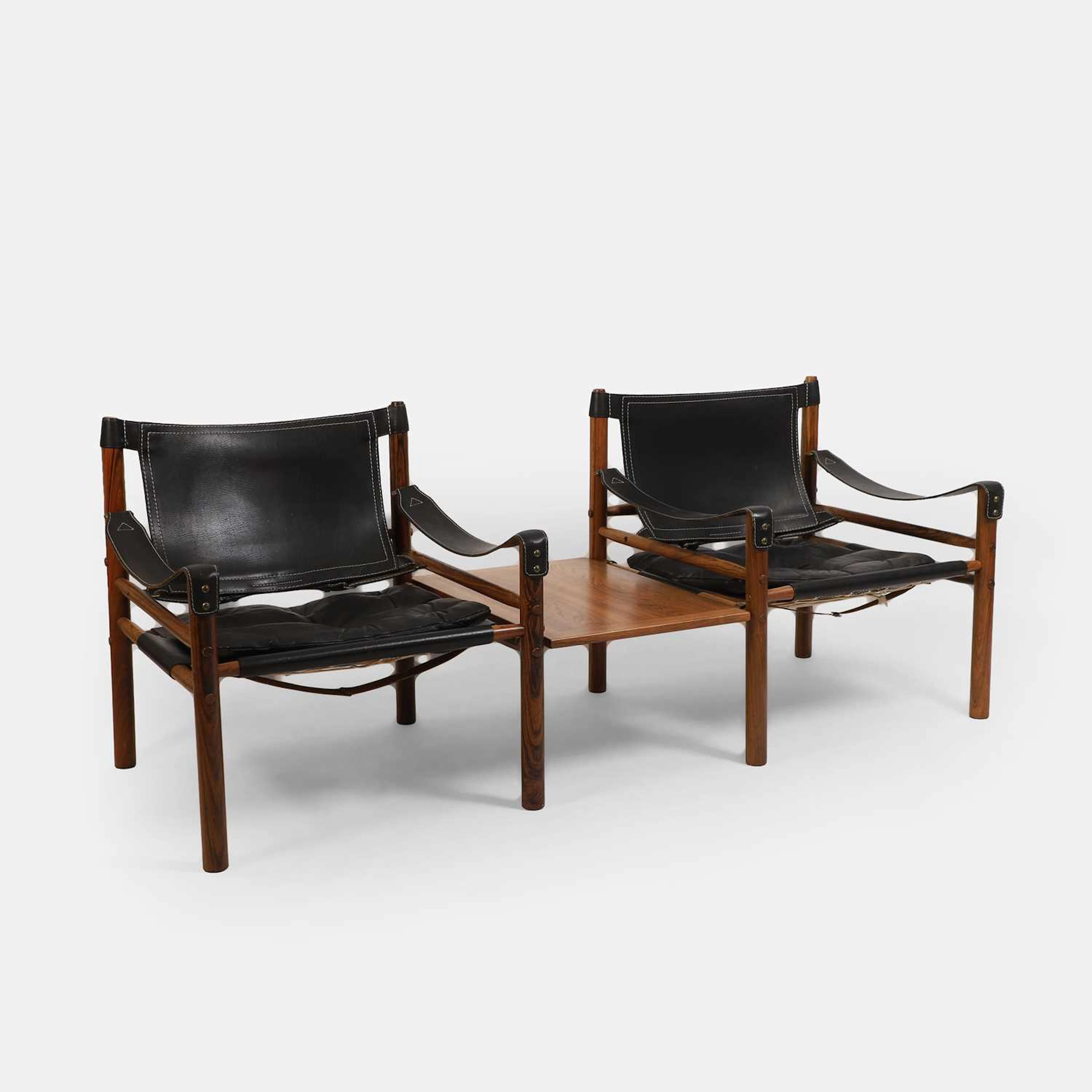 § Arne Norell (Swedish, 1917-1971) a pair of rosewood 'Sirocco' armchairs