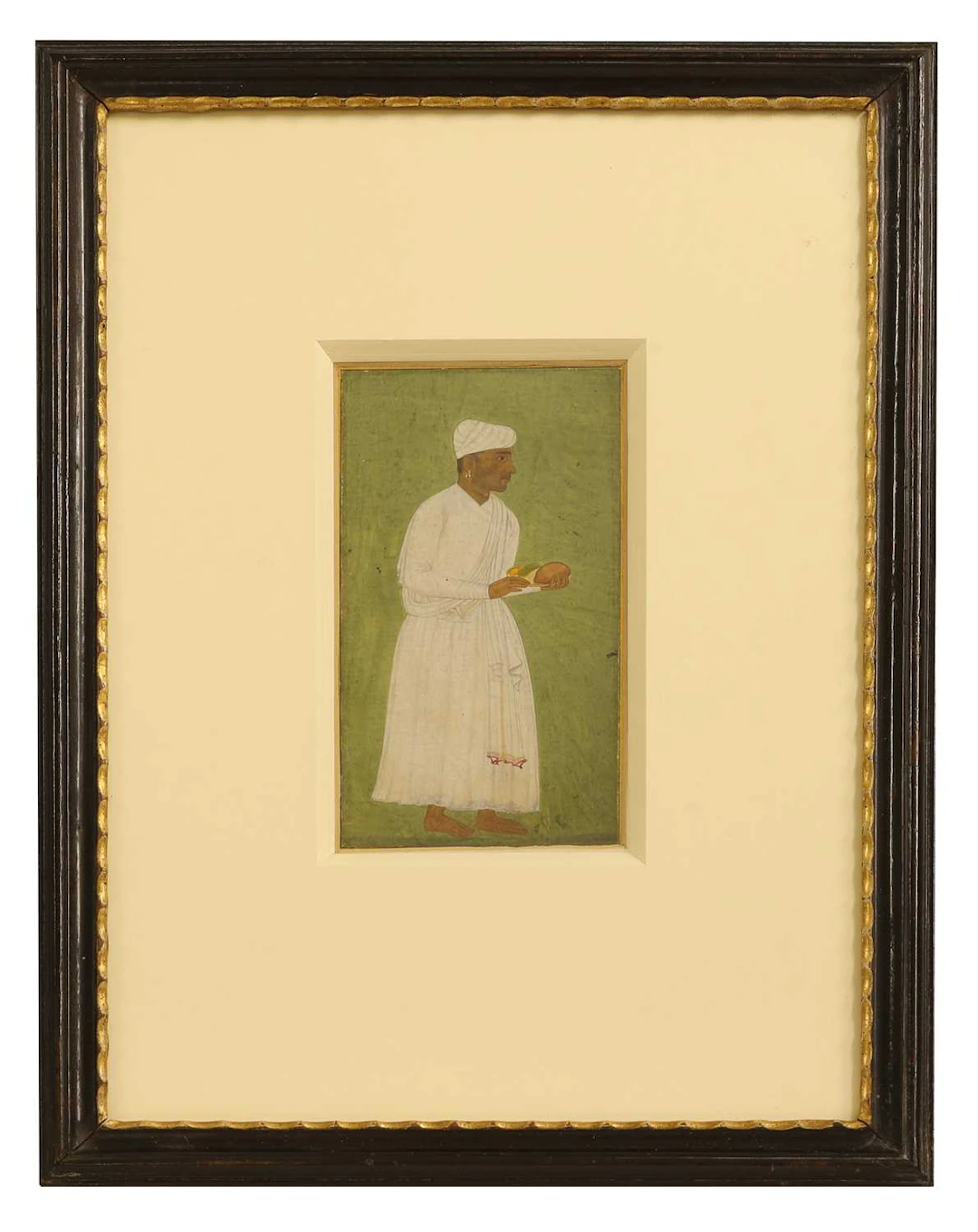 A Mughal portrait of a standing servant 17th century, Mughal Northern India