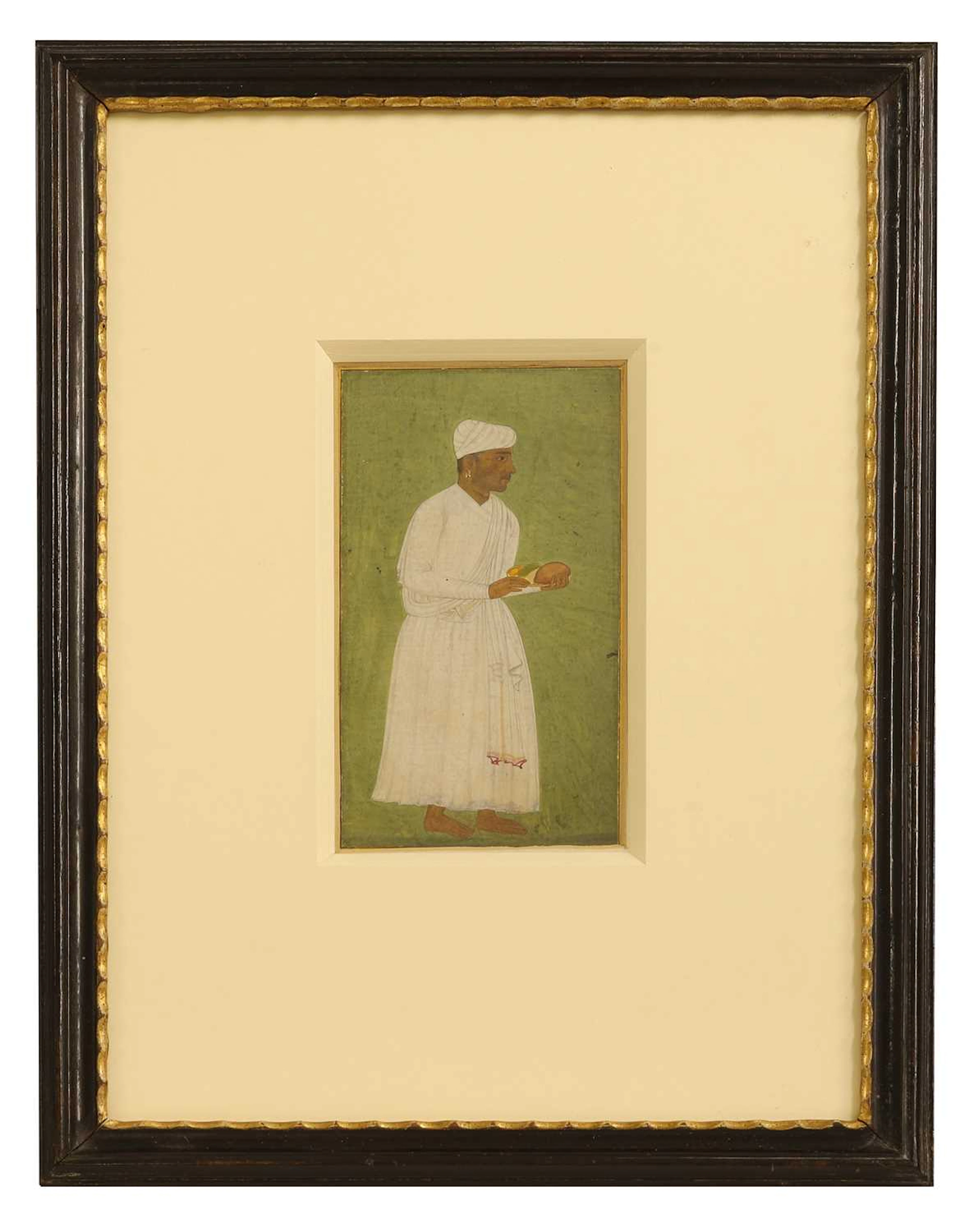 A Mughal portrait of a standing servant 17th century, Mughal Northern India
