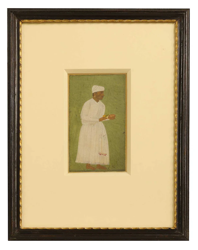 A Mughal portrait of a standing servant 17th century, Mughal Northern India
