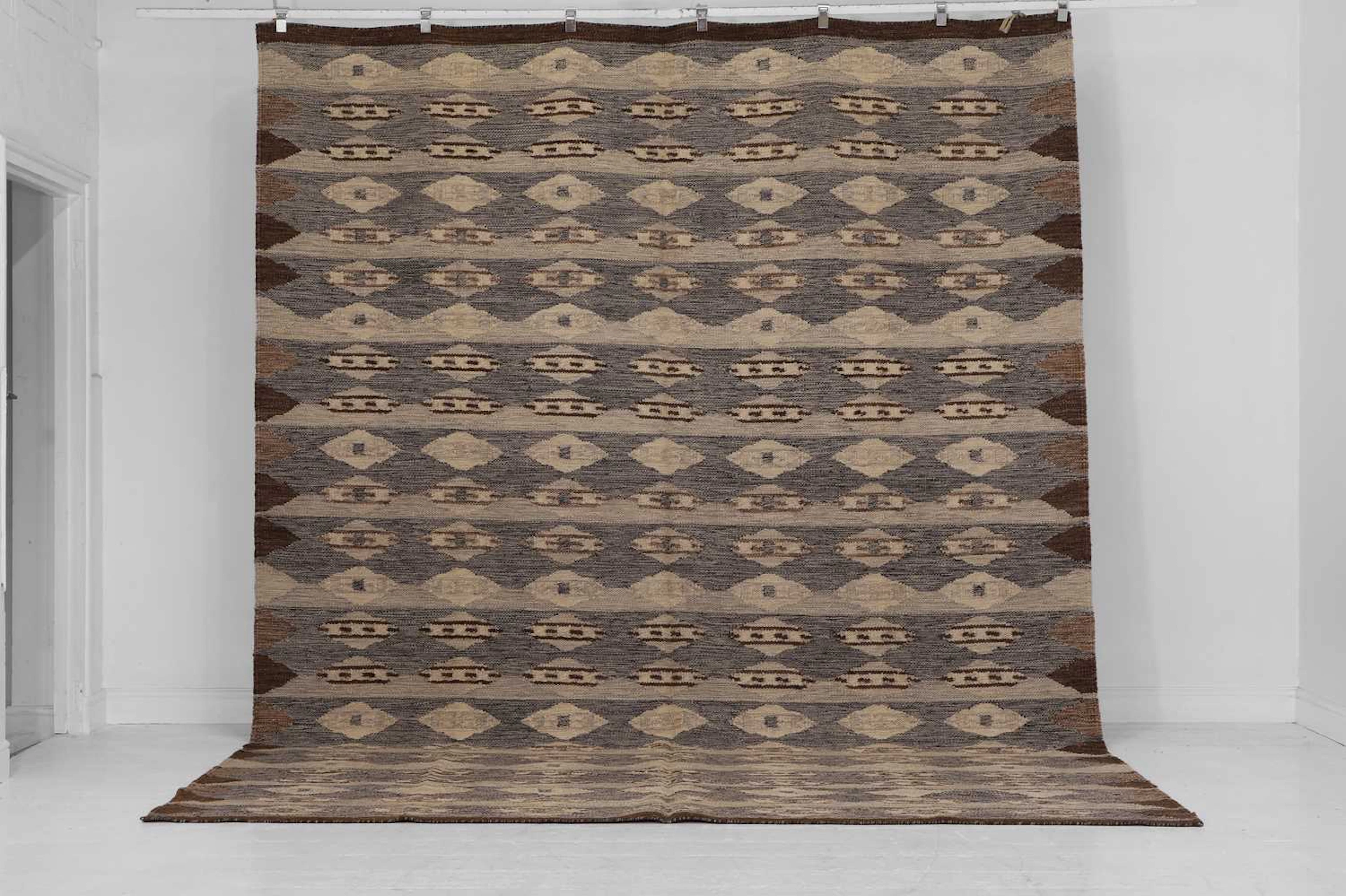 A flat-weave wool carpet of Scandinavian design