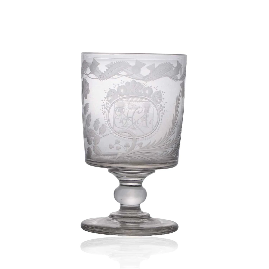 An oversized engraved glass rummer circa 1810