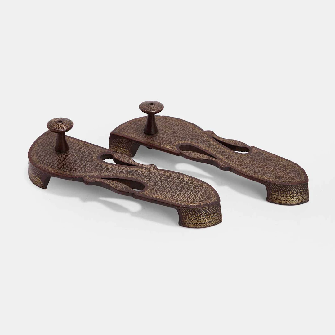 A pair of Indian brass-inlaid paduka sandals late 19th century/early