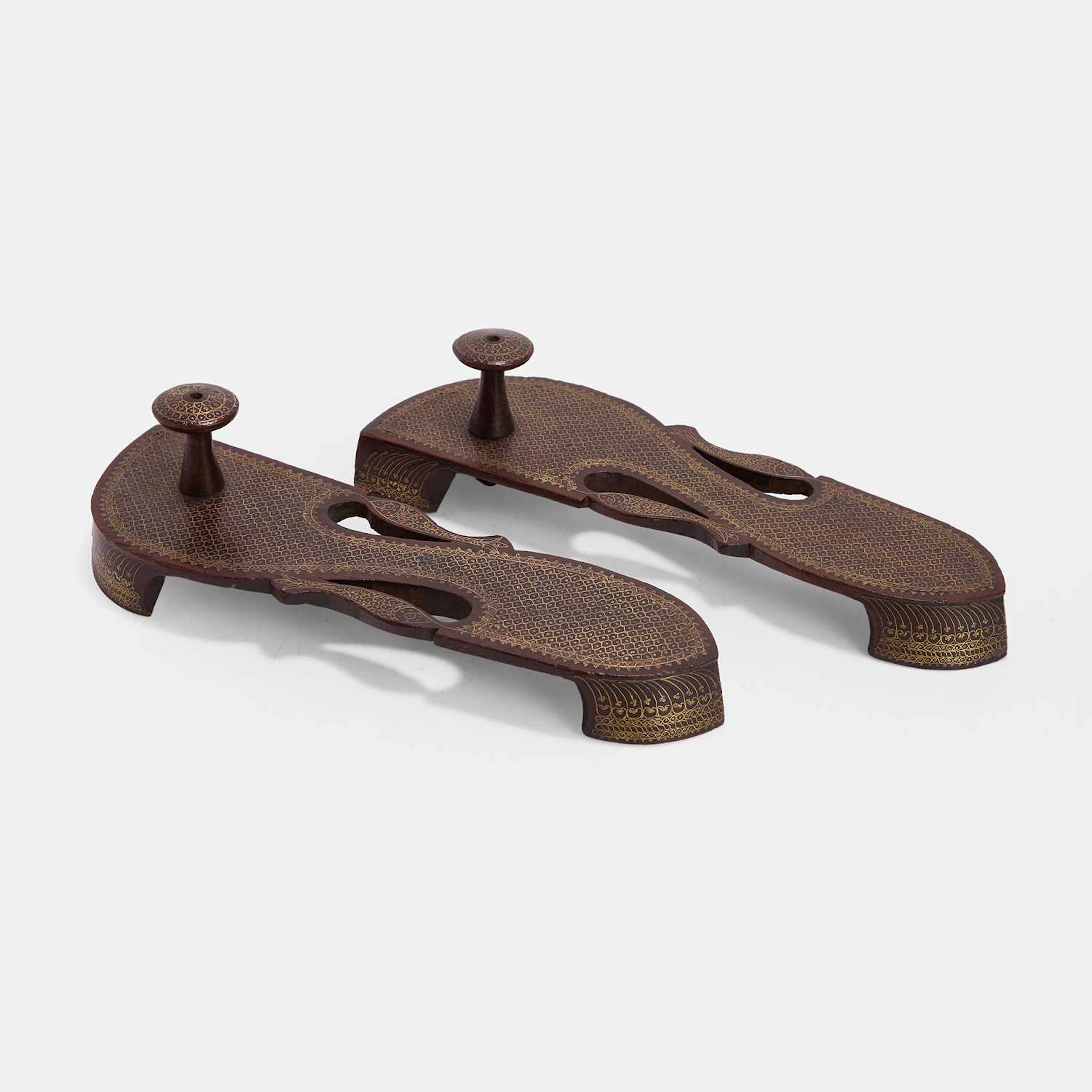 A pair of Indian brass-inlaid paduka sandals late 19th century/early