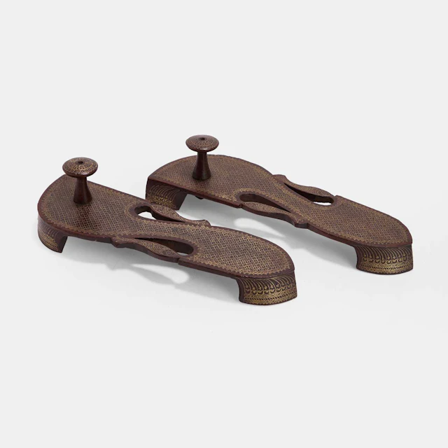 A pair of Indian brass-inlaid paduka sandals late 19th century/early