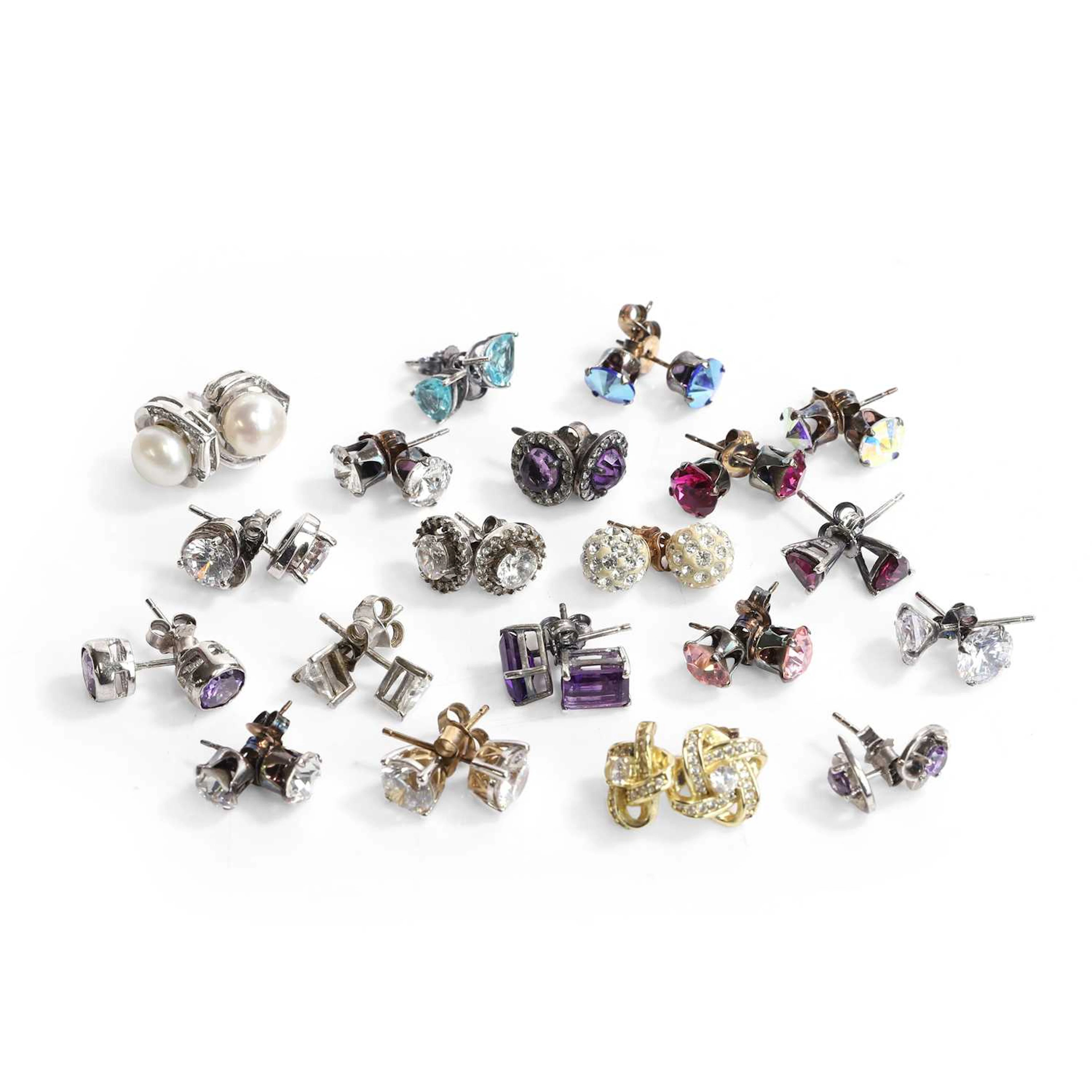 A collection of twenty pairs of silver Swarovski and cubic zirconia
