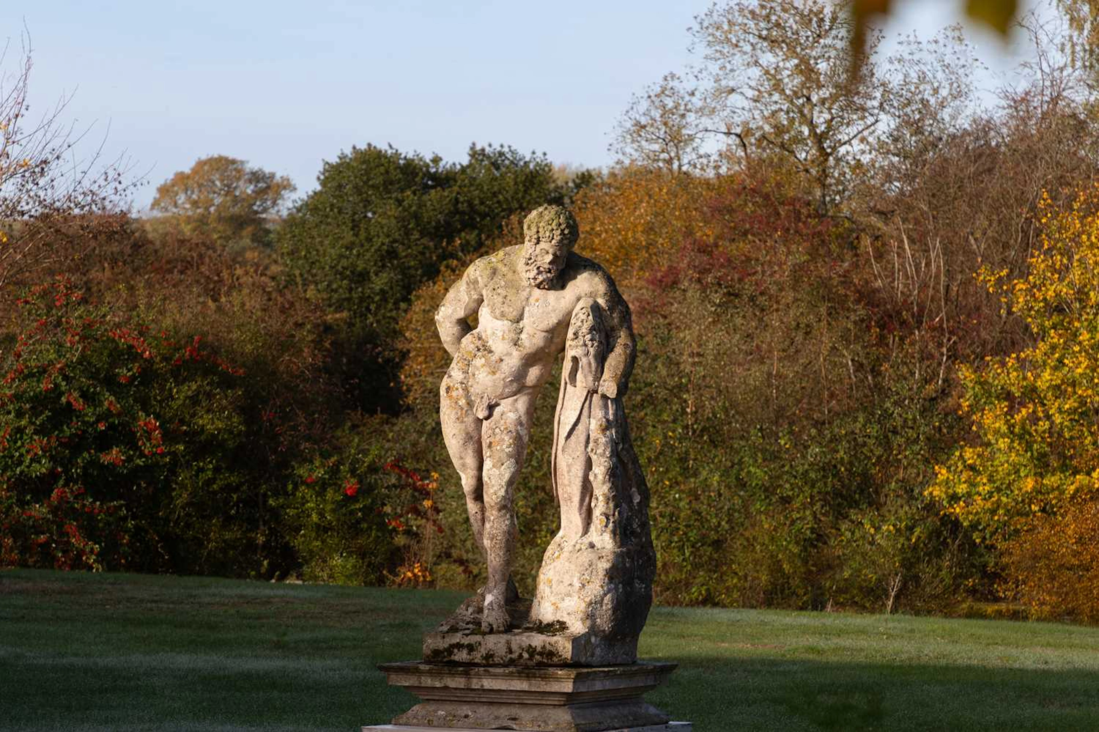 A carved limestone statue after the antique